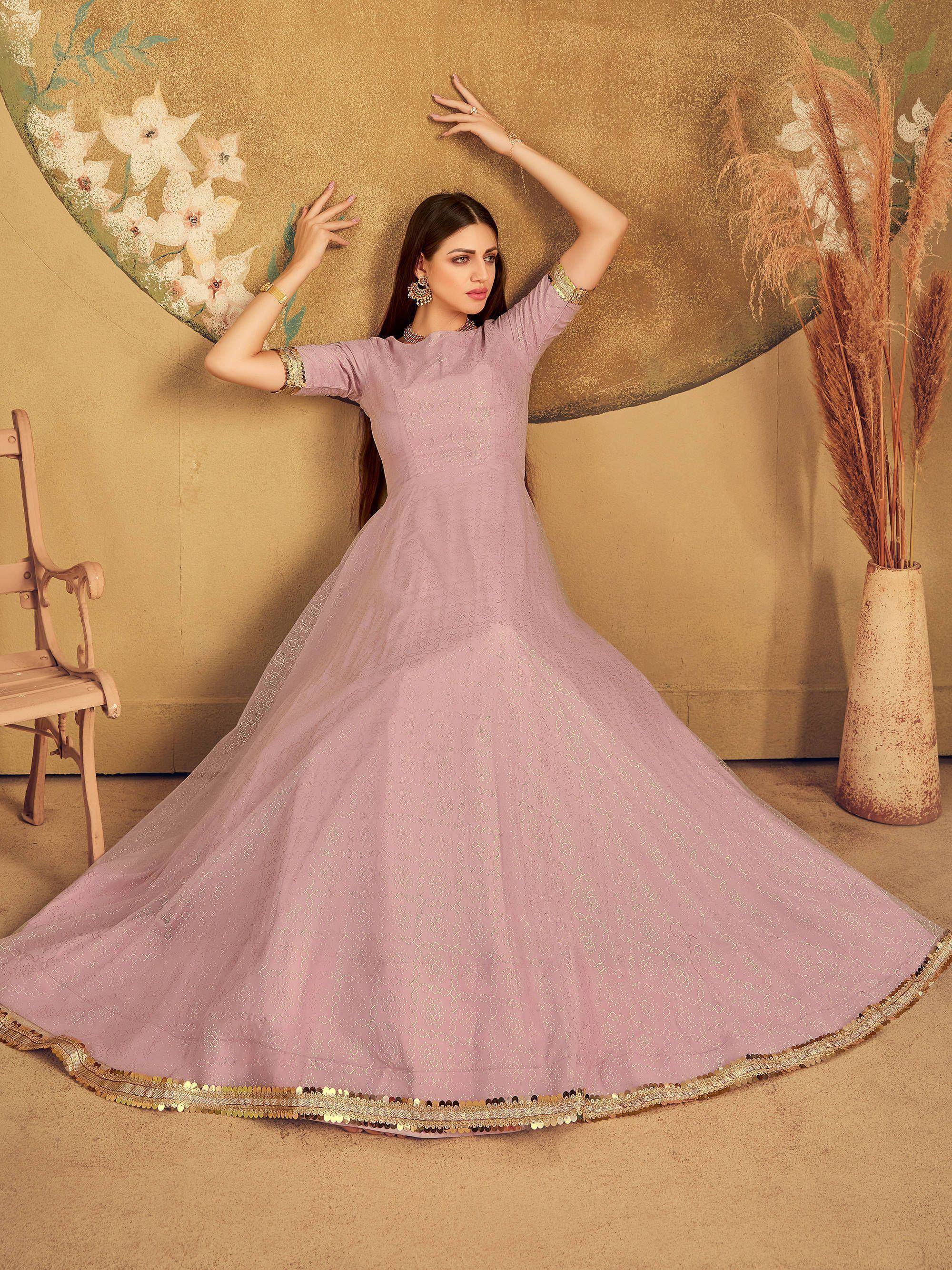 Elegant lavender ethnic gown with gold sequin trim, perfect for Indian weddings and festive occasions.