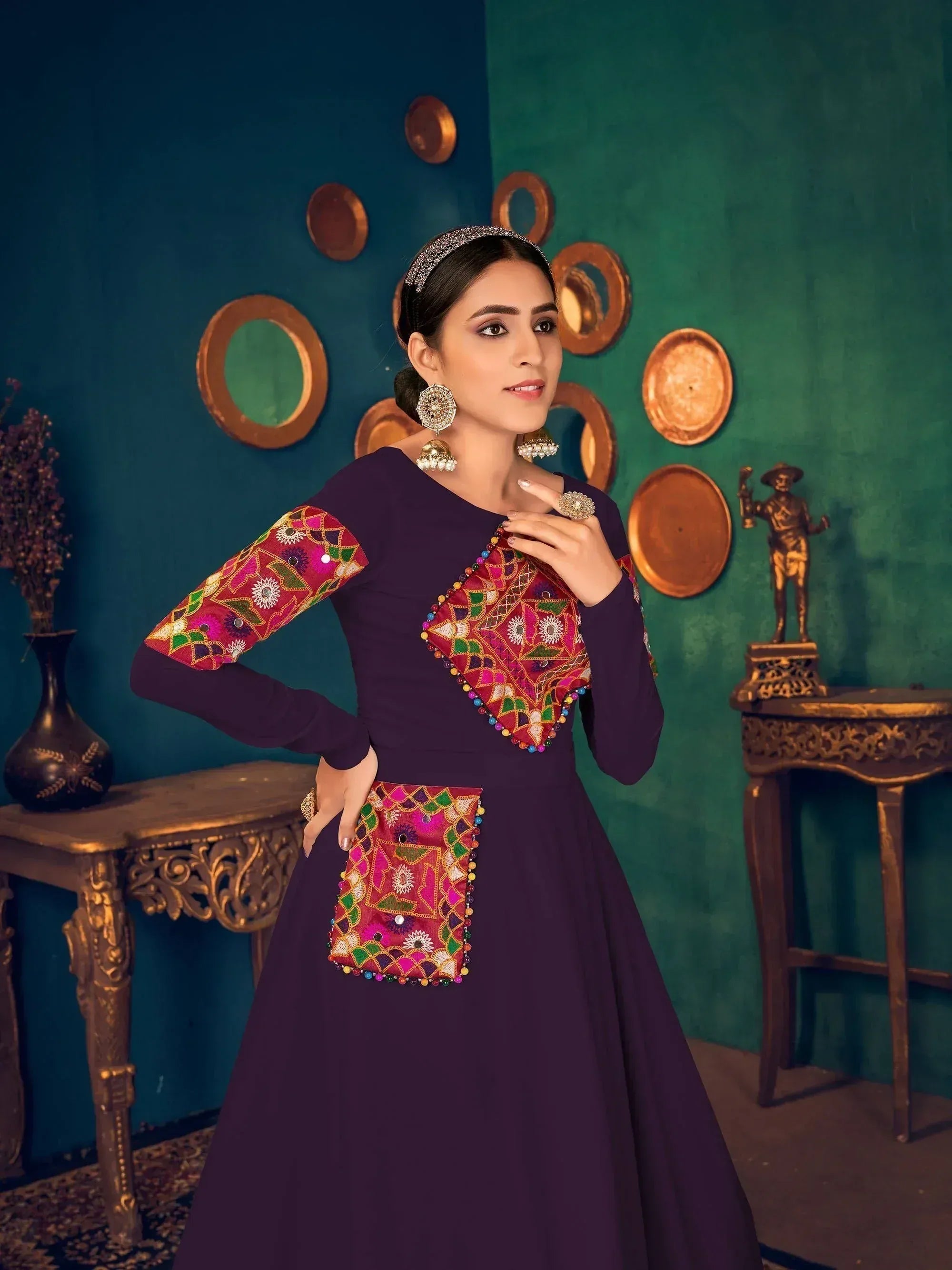 Purple ethnic gown with colorful mirror work and embroidery, perfect for Indian festive occasions