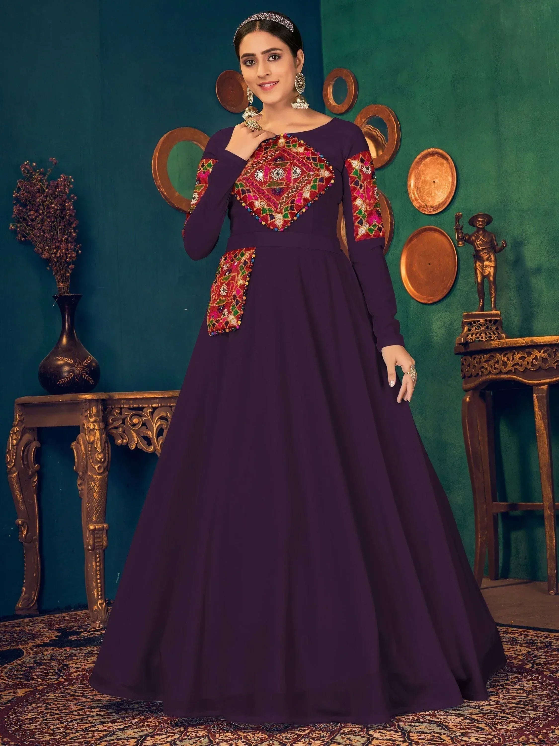 Purple ethnic gown with colorful embroidered panels, perfect for Indian festive occasions and weddings.