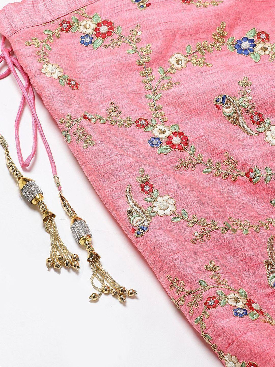 Pink ethnic wear with floral embroidery and gold tassels, perfect for Indian designer lehenga or saree styling