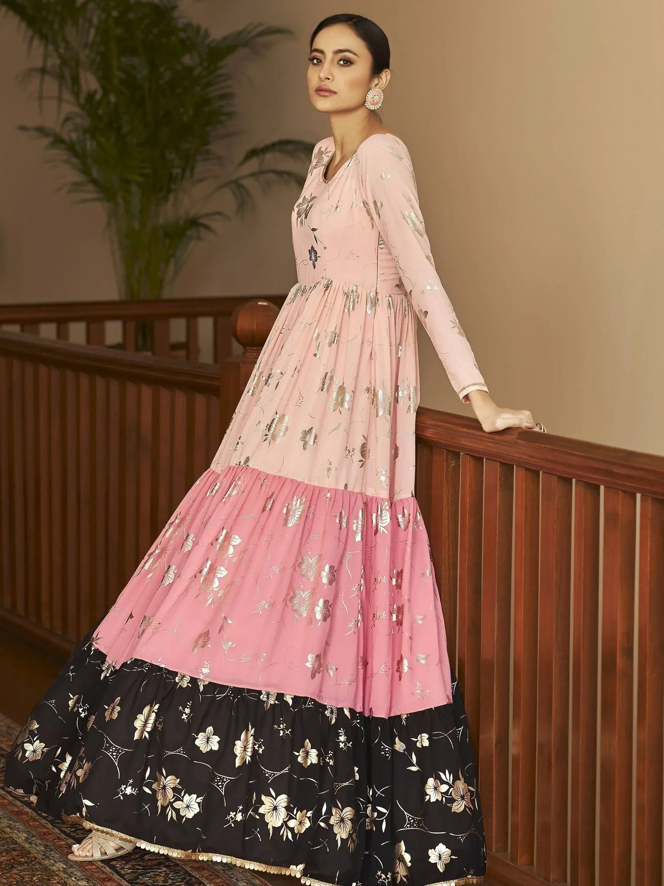 Pink and black floral print ethnic gown with gold embroidery, perfect for Indian occasions