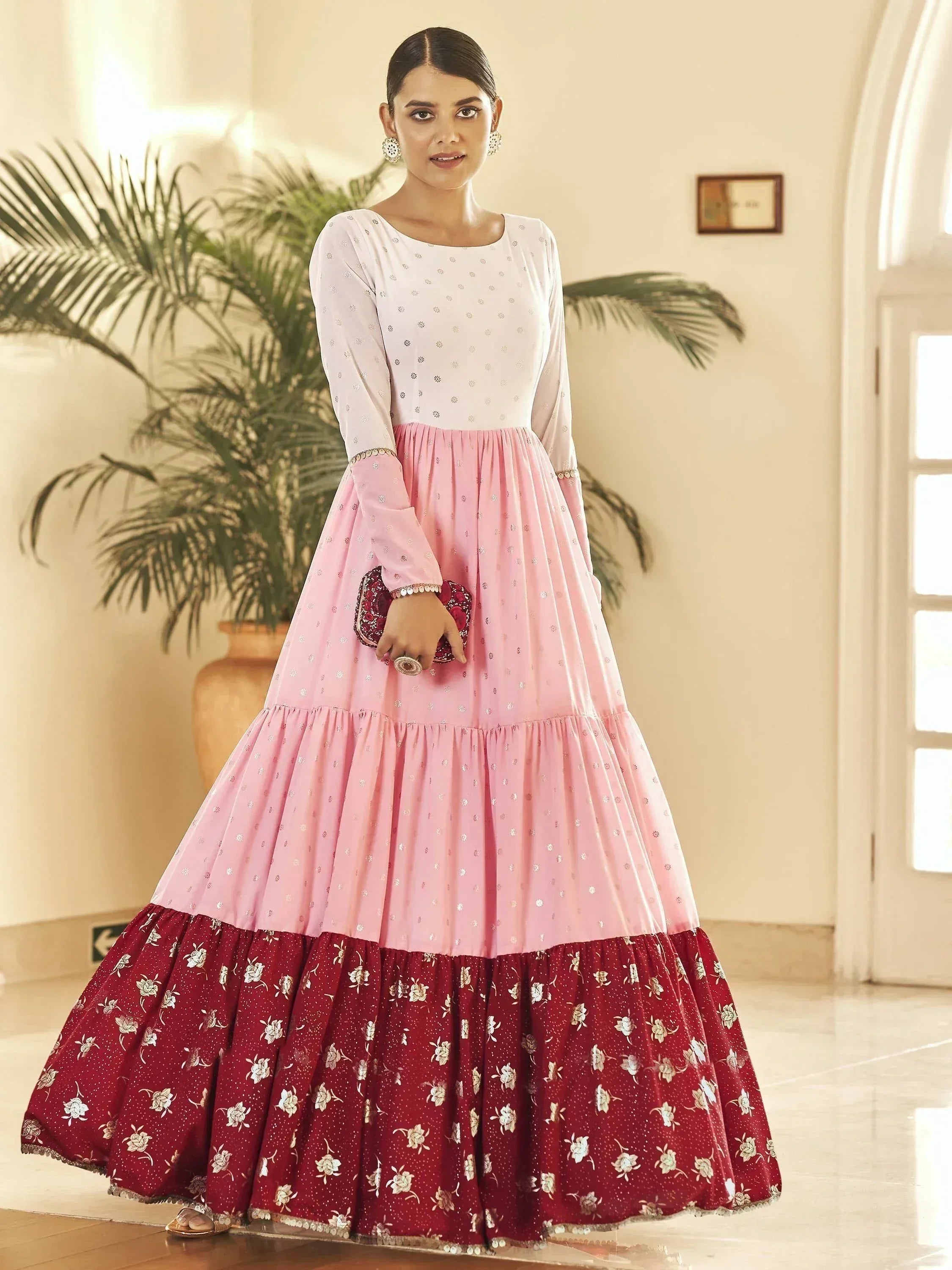 Pink and maroon floral tiered ethnic gown with embroidered top, perfect for Indian occasions