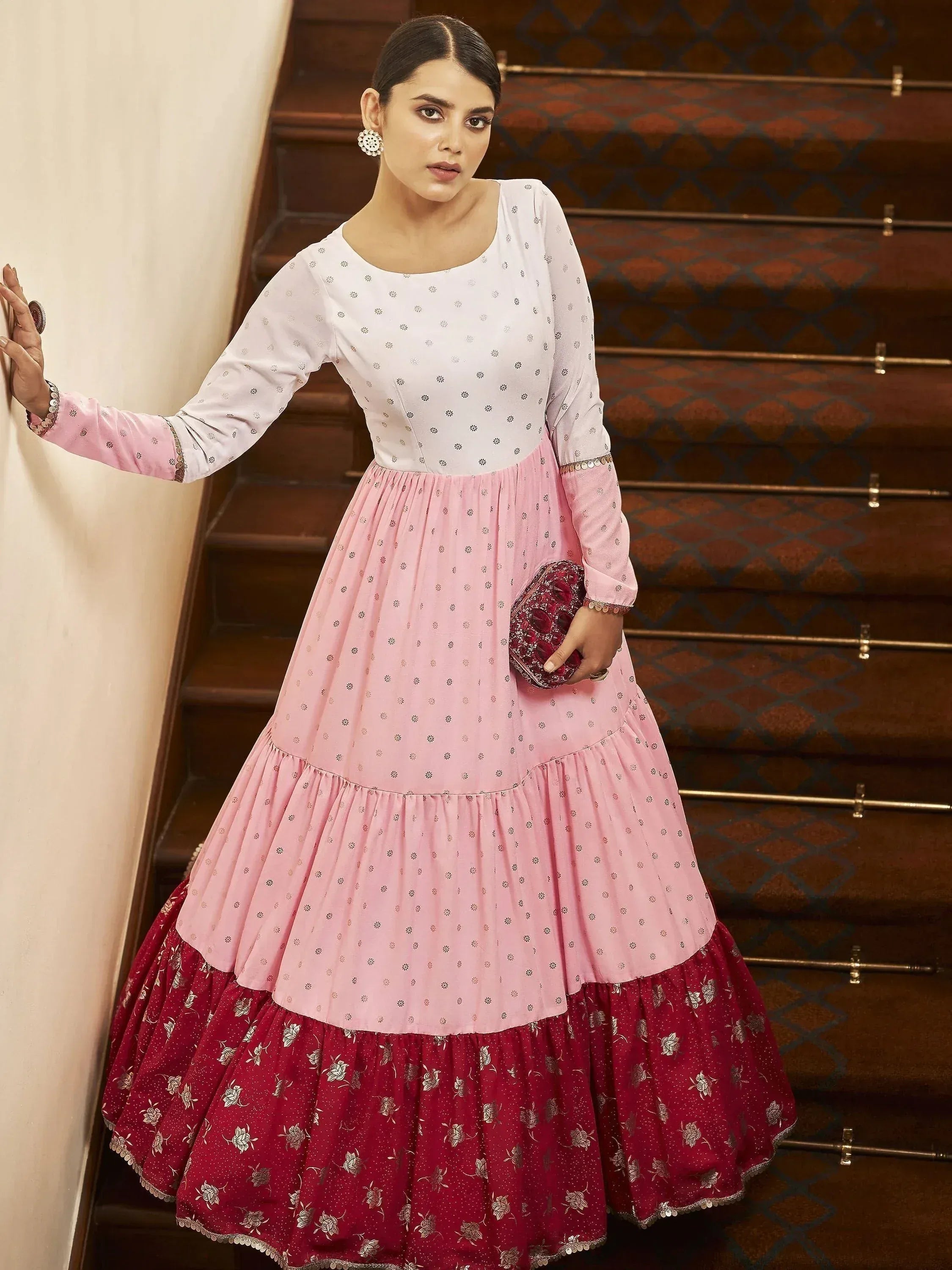 Pink and maroon tiered ethnic gown with floral embroidery, perfect for Indian celebrations