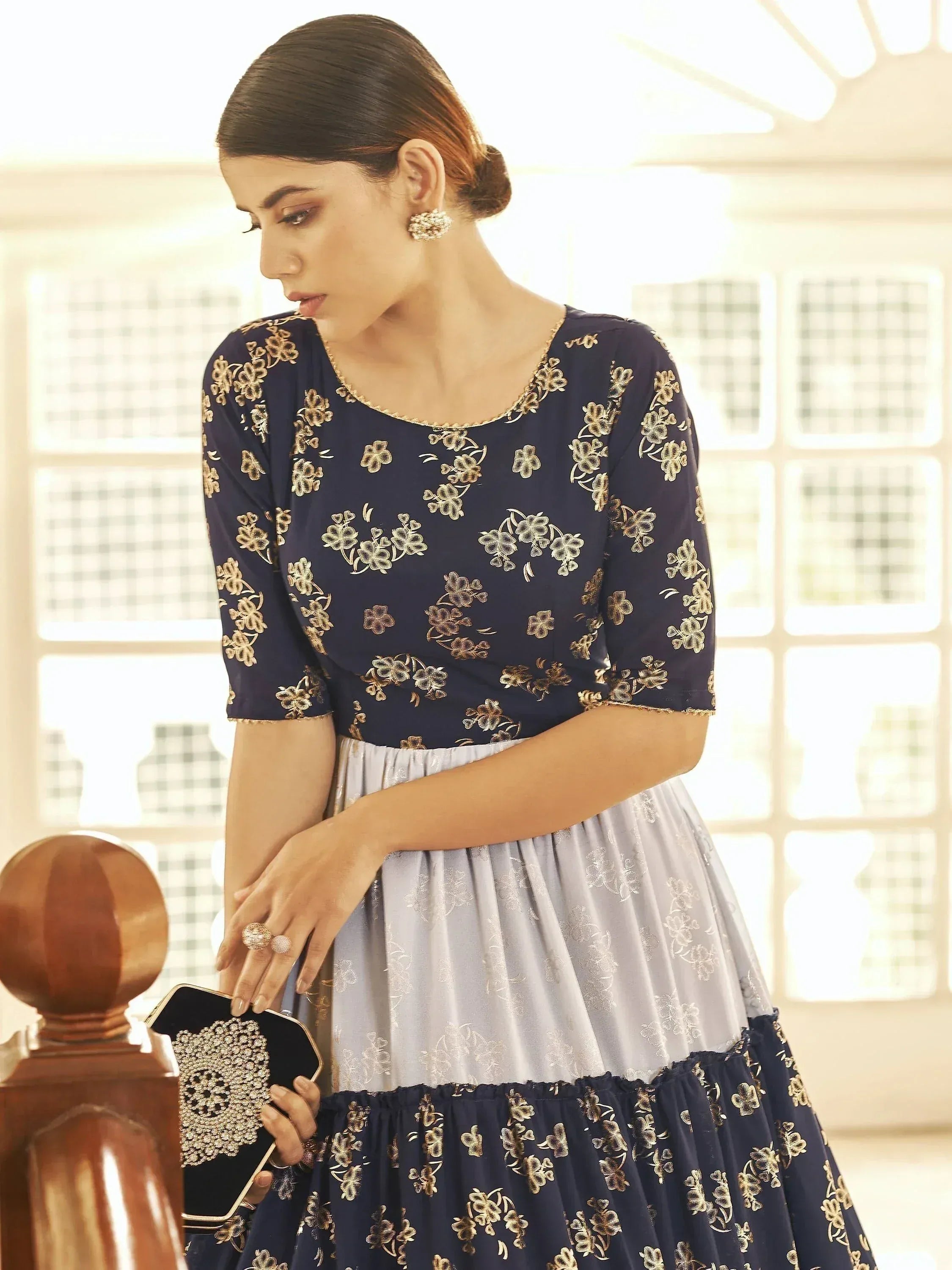Navy blue and silver floral embroidered ethnic gown with gold detailing, perfect for Indian occasions