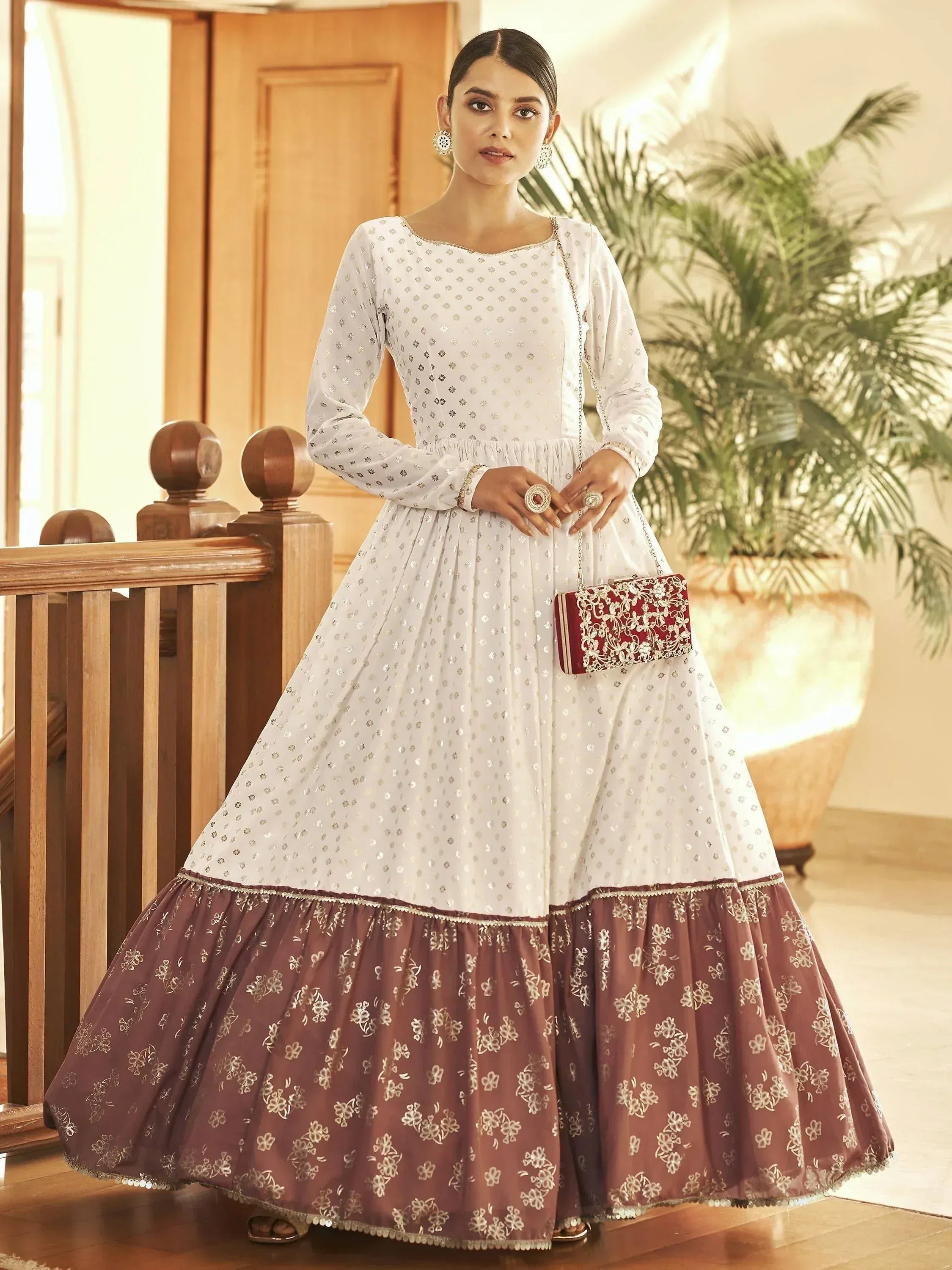 White and maroon ethnic gown with floral embroidery, perfect for Indian festive occasions and weddings.