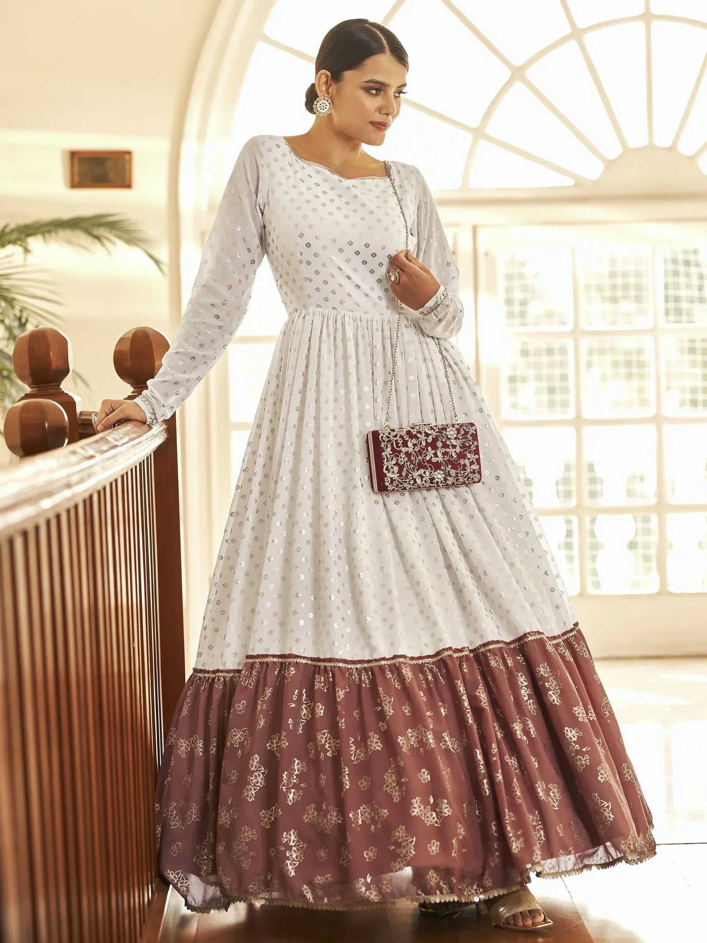 Elegant white and maroon ethnic gown with floral embroidery, perfect for Indian celebrations