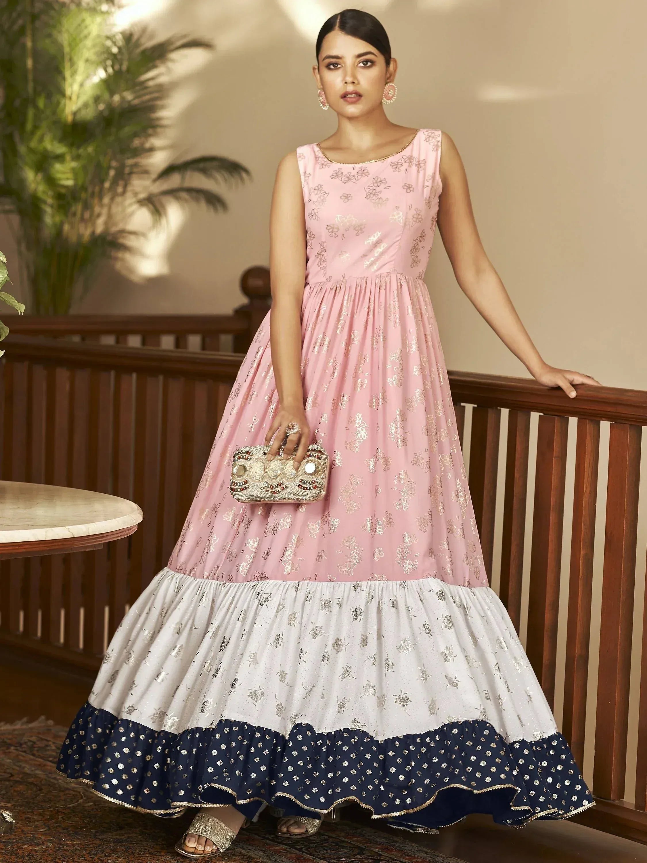 Elegant pink and navy ethnic gown with floral embroidery, perfect for Indian festive occasions.