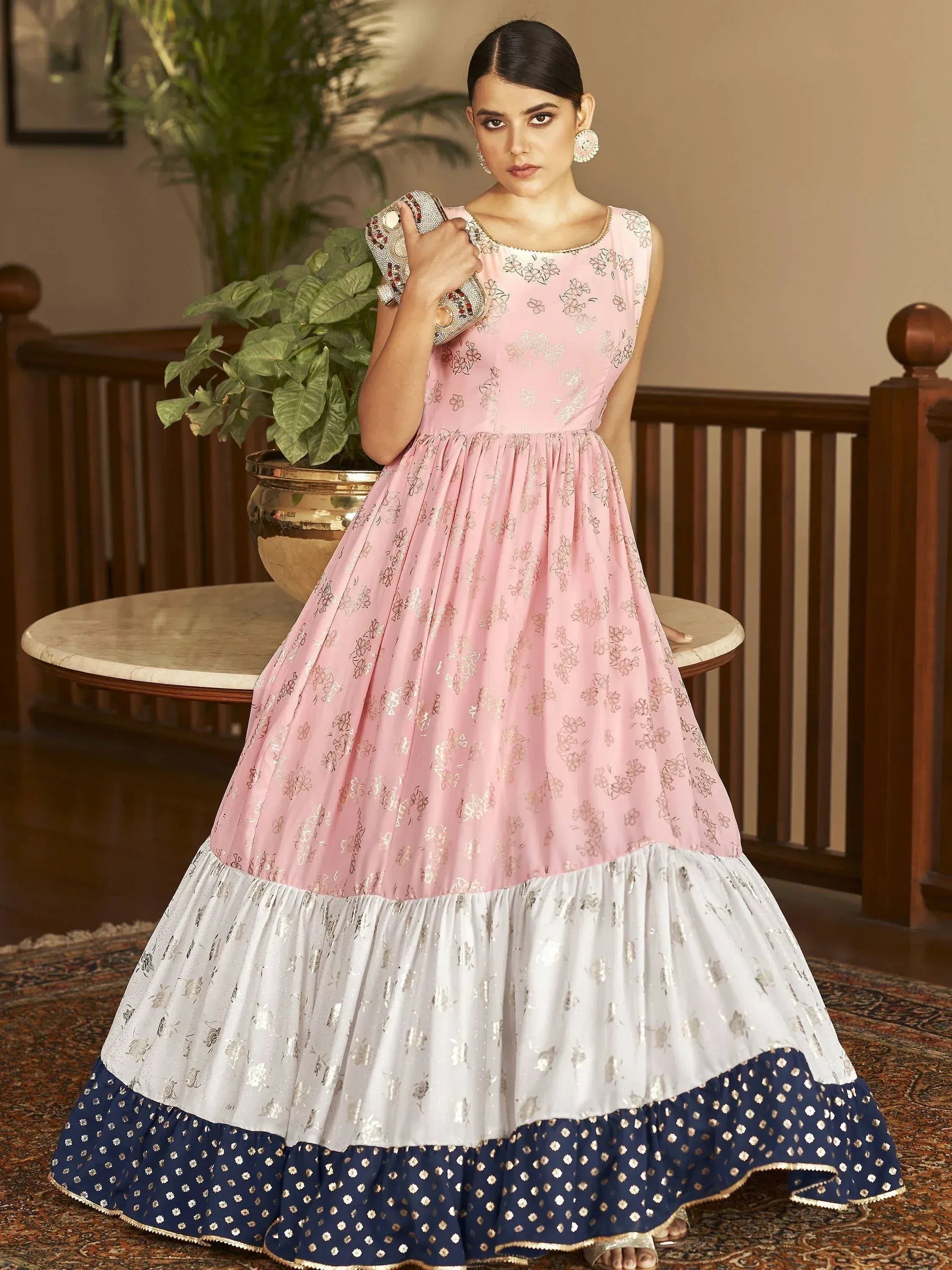 Pink and white floral ethnic gown with blue border, perfect for Indian celebrations