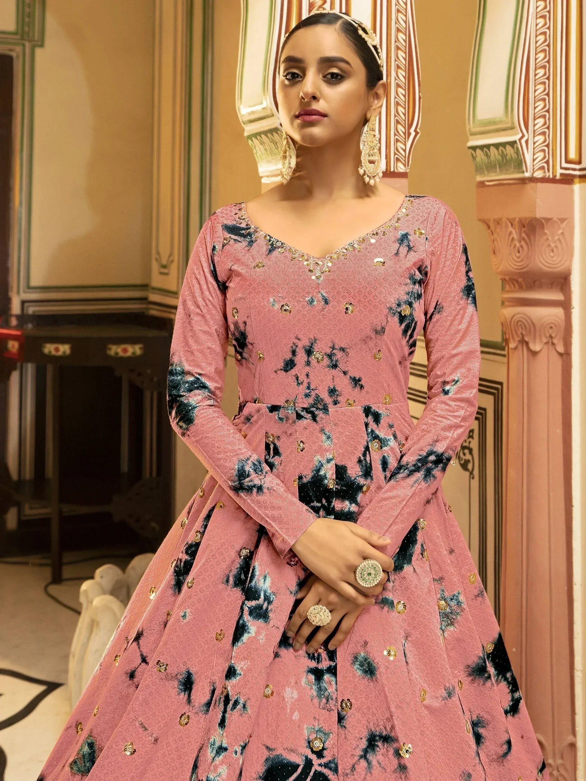 Pink floral embroidered ethnic gown with gold detailing, perfect for Indian weddings and festive occasions.
