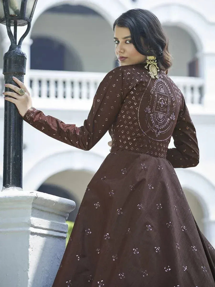 Brown ethnic gown with intricate back embroidery and sequin detailing, perfect for Indian occasions