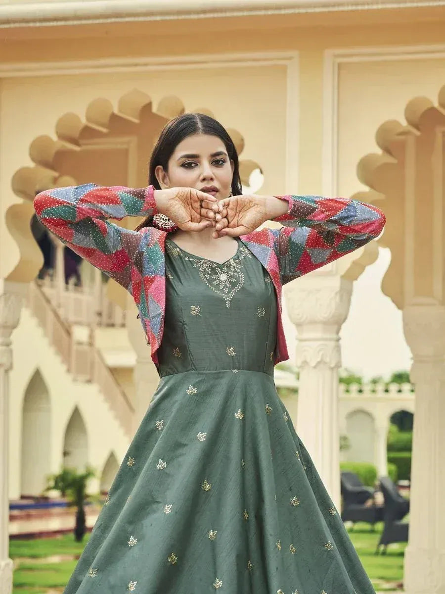 Green embroidered ethnic gown with colorful printed jacket, perfect for Indian festive occasions