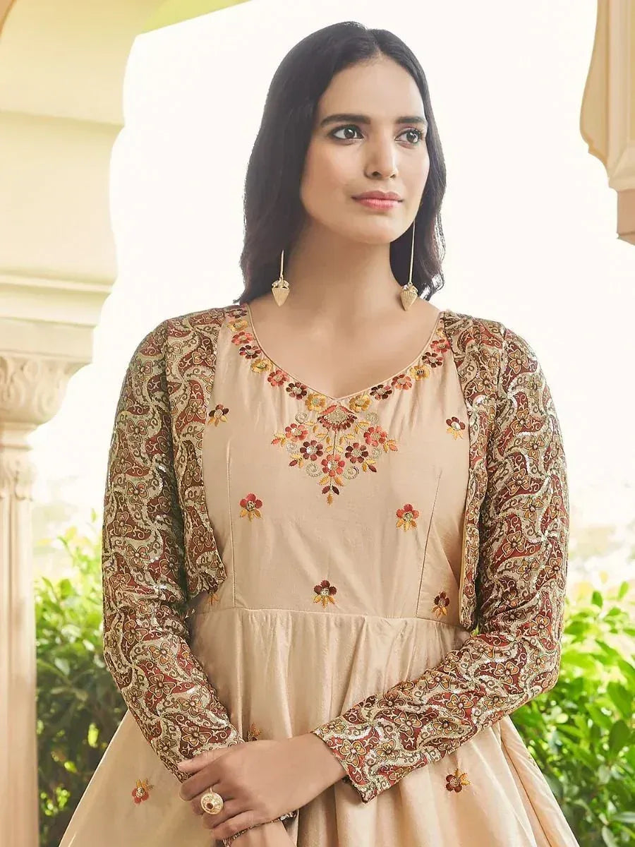 Beige embroidered ethnic gown with floral patterned sleeves, perfect for Indian occasions