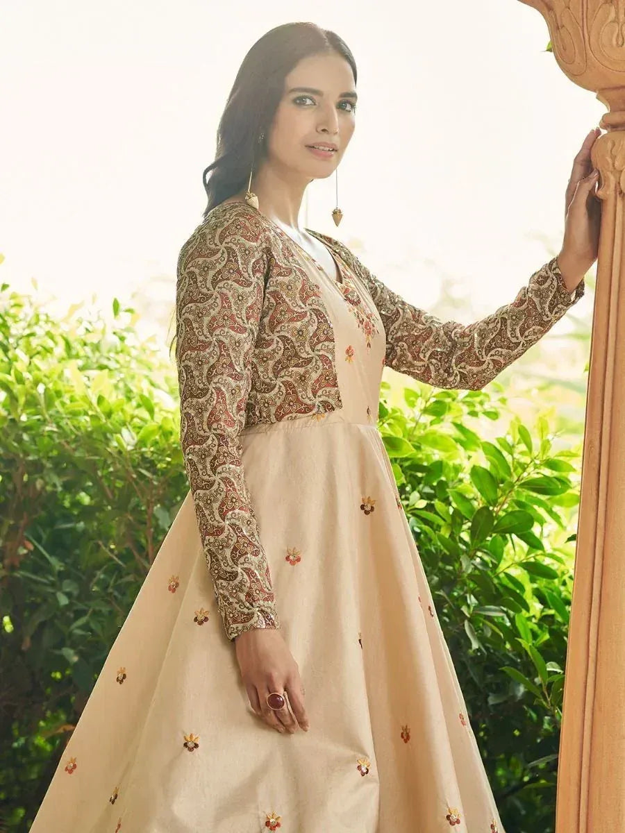 Beige ethnic gown with floral embroidery and paisley sleeves, perfect for Indian occasions