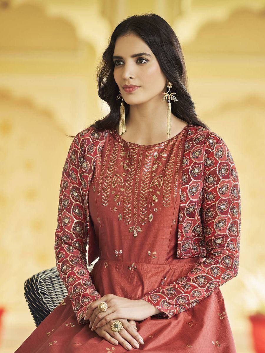 Elegant maroon ethnic gown with gold embroidery, perfect for Indian occasions and festive wear.