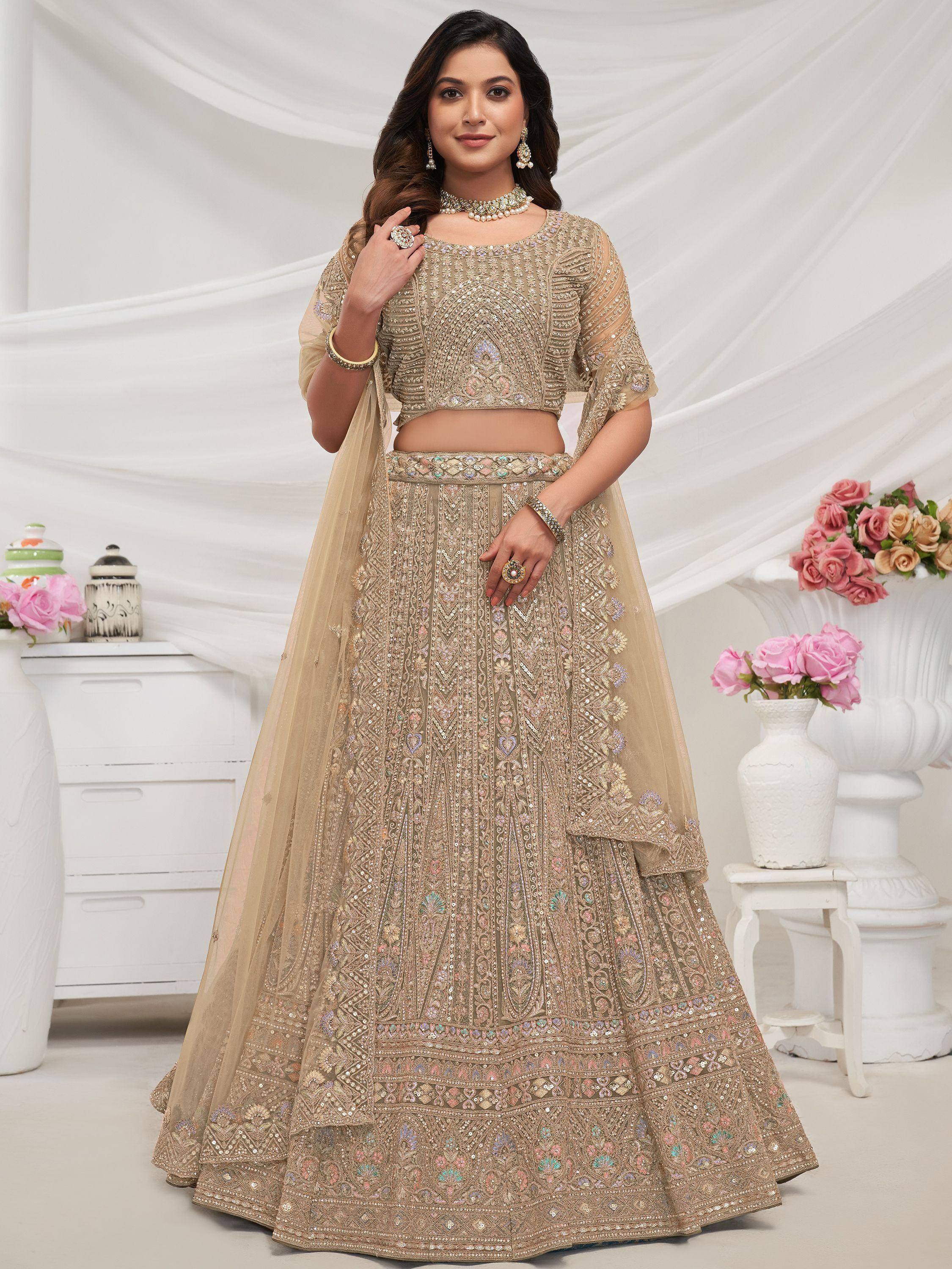 Beige embroidered lehenga choli with sequin work, perfect for Indian weddings and festive occasions.