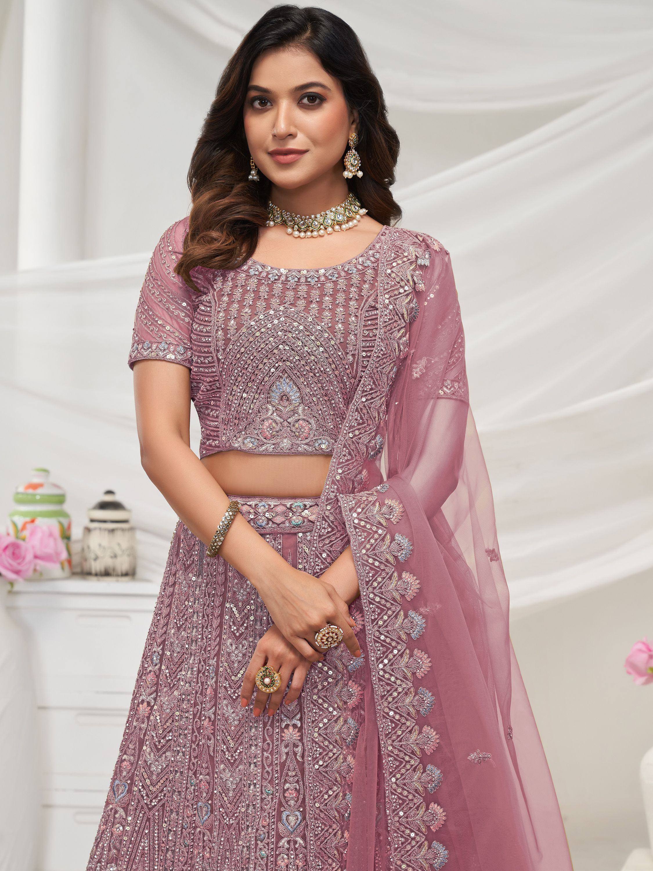 Pink embroidered lehenga choli with sheer dupatta, perfect for Indian weddings and festive occasions