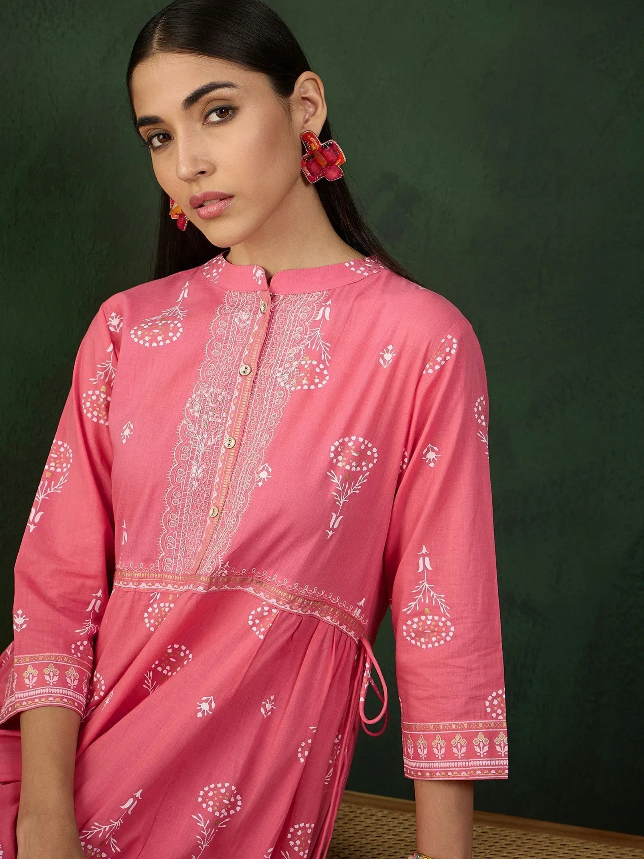 Pink ethnic kurta with white block print and embroidery, styled with statement earrings