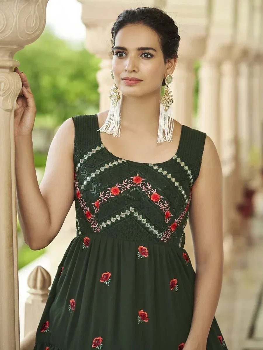 Green embroidered ethnic gown with red floral motifs, perfect for Indian occasions