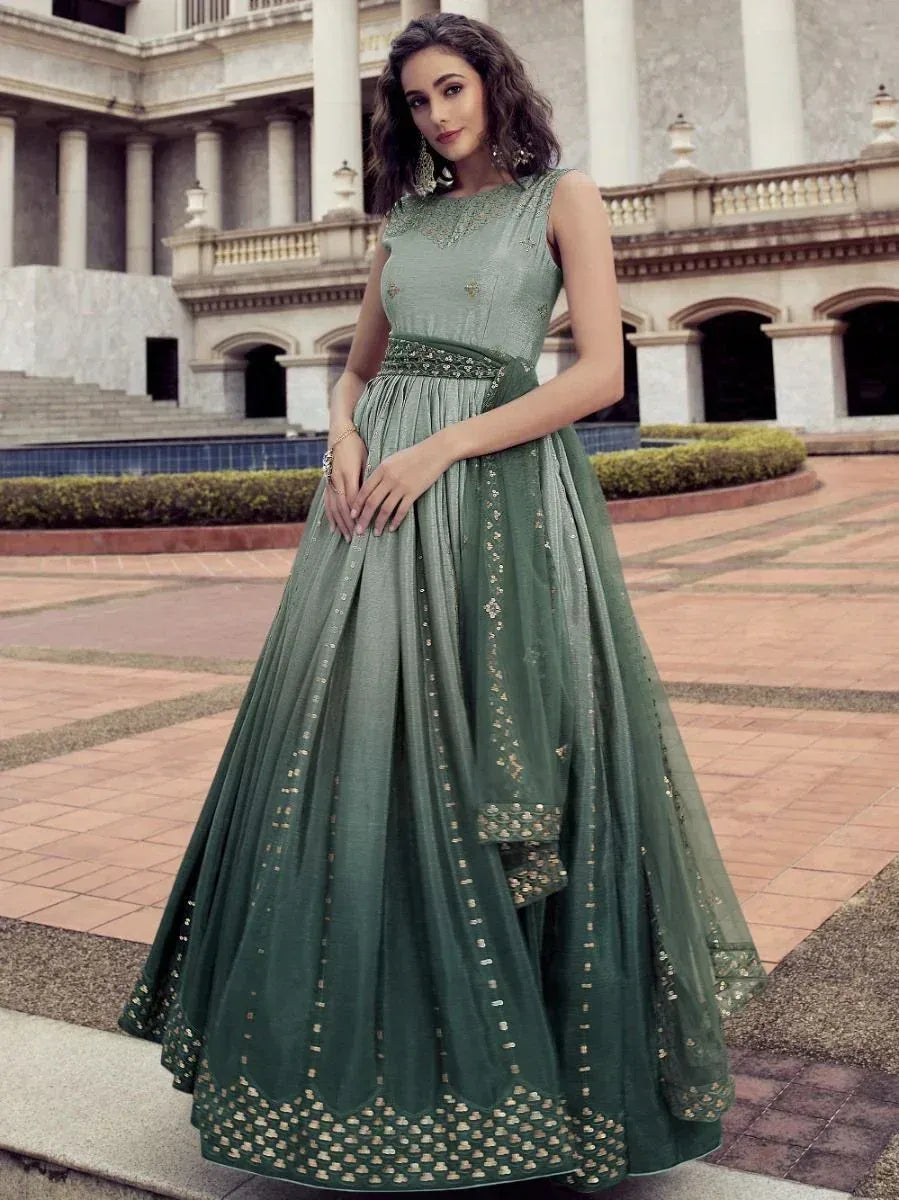 Elegant green designer lehenga choli with gold embroidery, perfect for Indian ethnic occasions.
