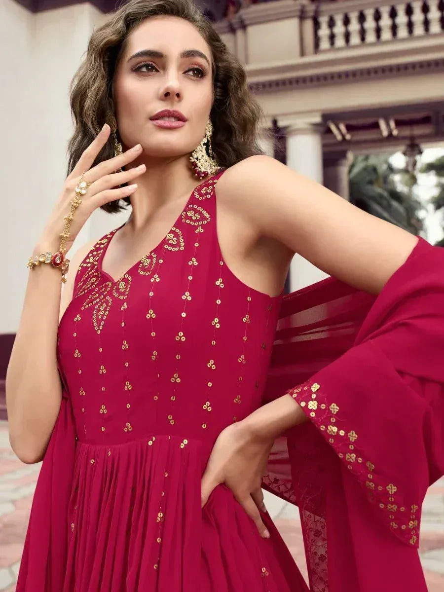 Red ethnic gown with gold embroidery, perfect for Indian occasions and festive wear