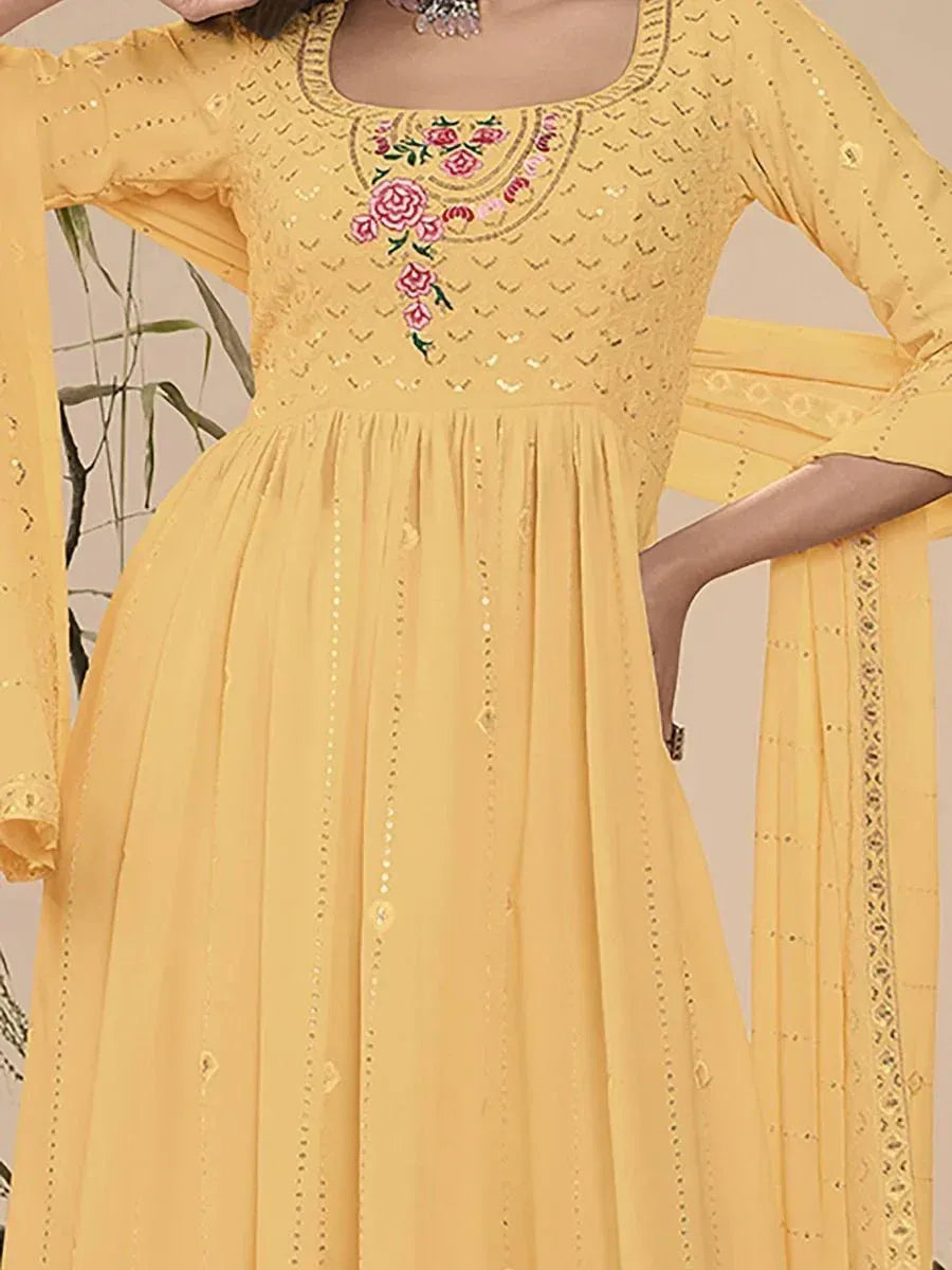 Yellow Indian ethnic gown with sequin detailing and floral embroidery on the neckline