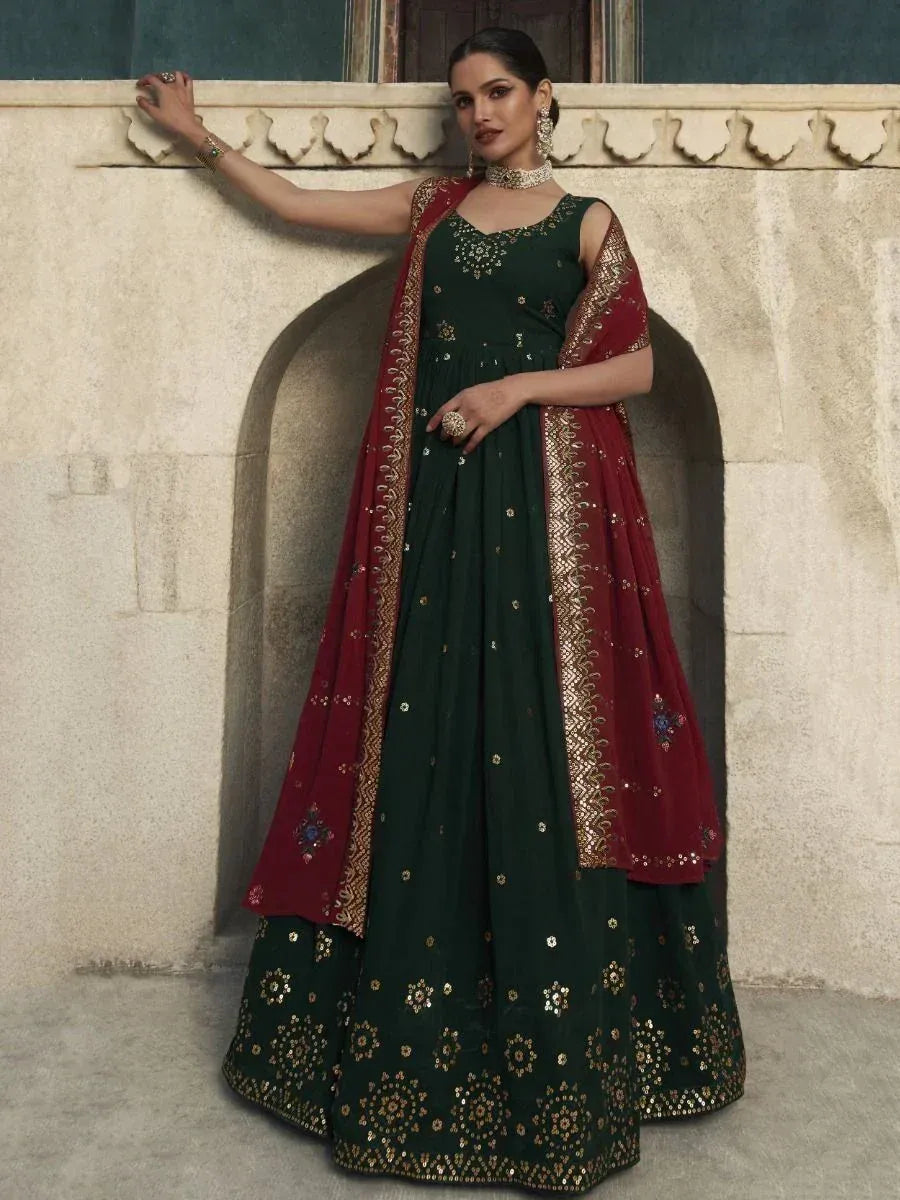 Elegant green and maroon embroidered lehenga choli with gold detailing for festive occasions