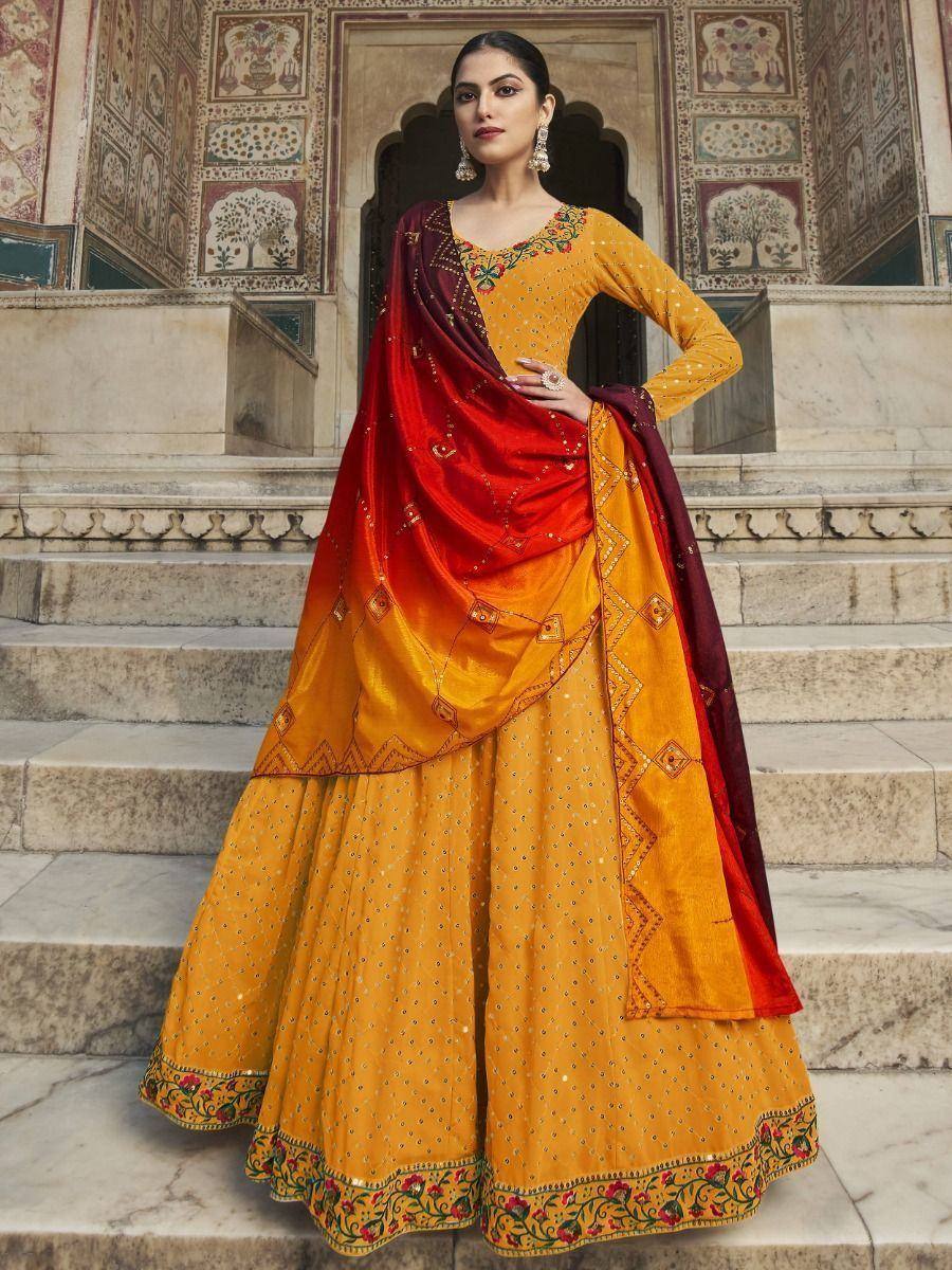Yellow embroidered lehenga choli with red dupatta, traditional Indian ethnic wear for weddings and festivals