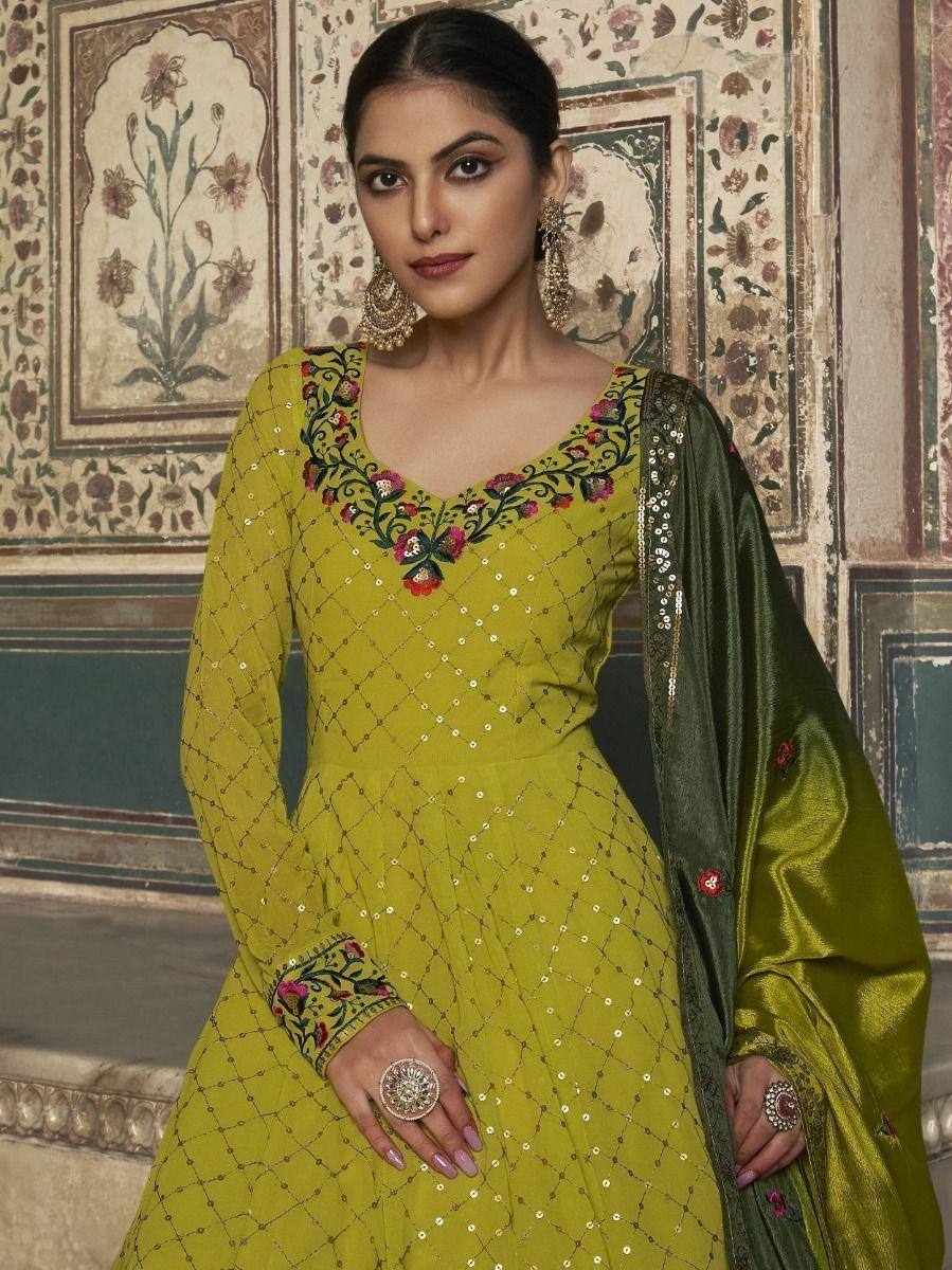 Elegant green embroidered salwar kameez with sequin work and matching dupatta, perfect for Indian ethnic occasions.