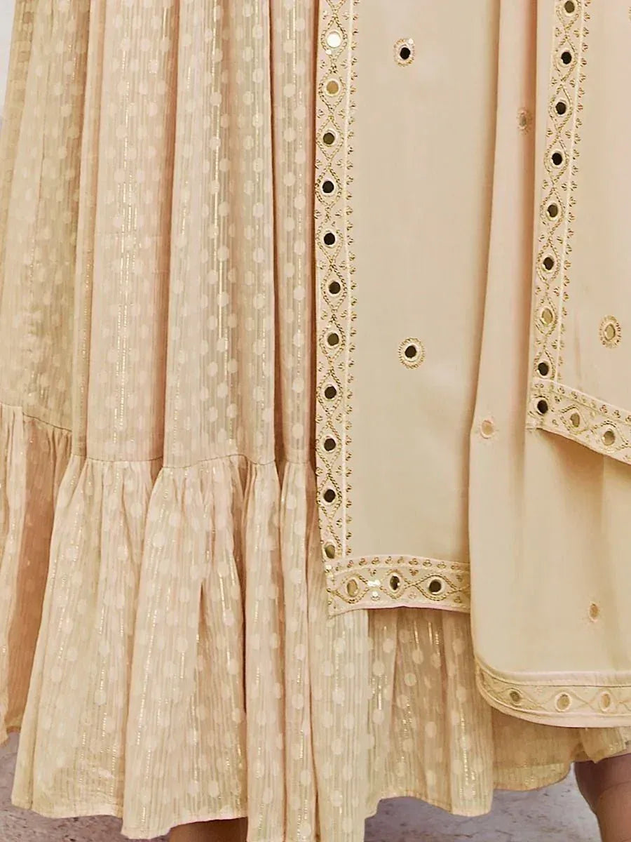 Beige lehenga skirt with gold polka dot pattern and dupatta featuring mirror work border