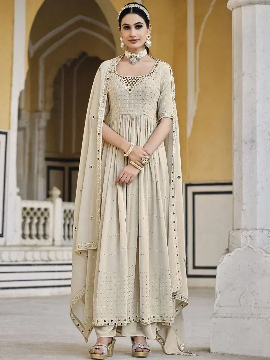 Woman in cream embroidered Anarkali suit with dupatta, Indian ethnic wear fashion