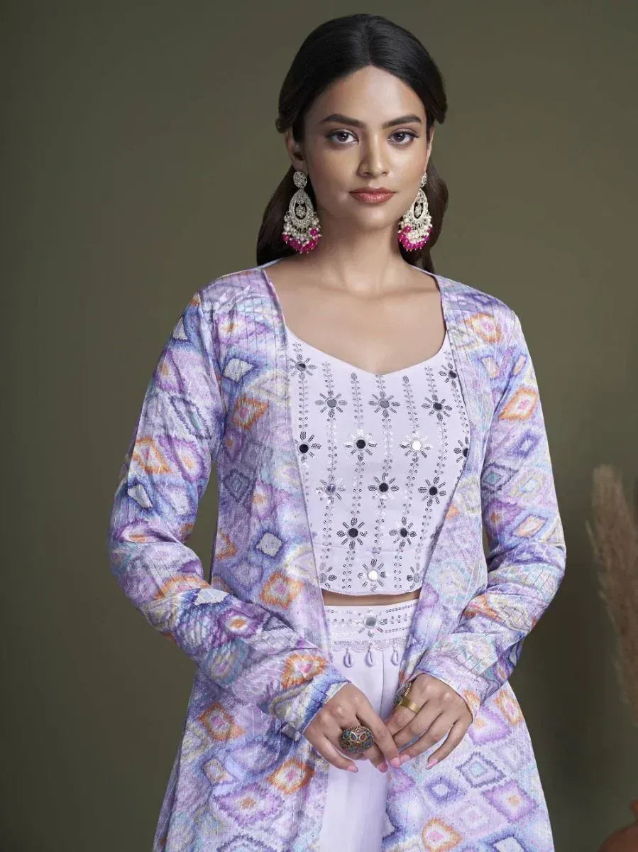 Purple printed ethnic kurta with embroidered white crop top and palazzo pants, styled with statement earrings
