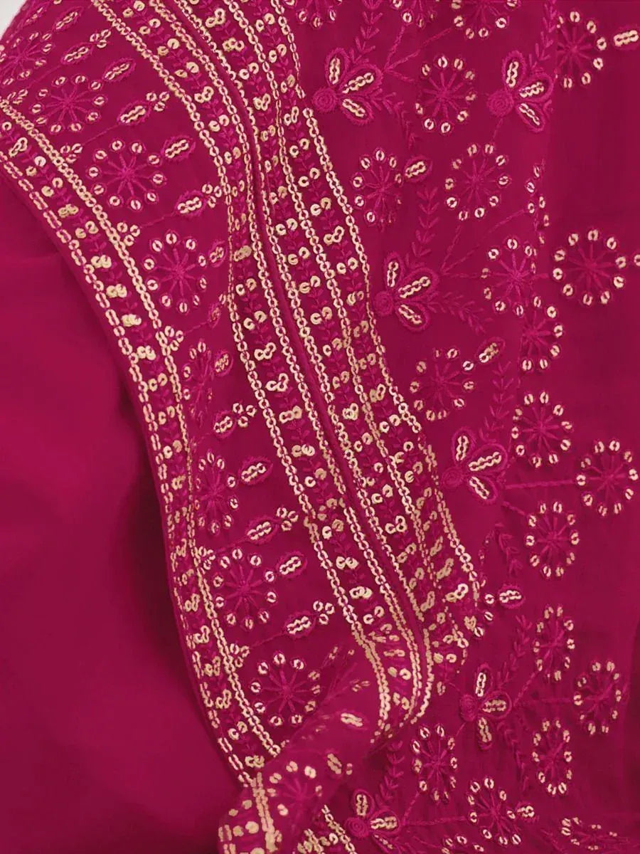 Magenta Indian ethnic fabric with intricate gold embroidery and floral patterns