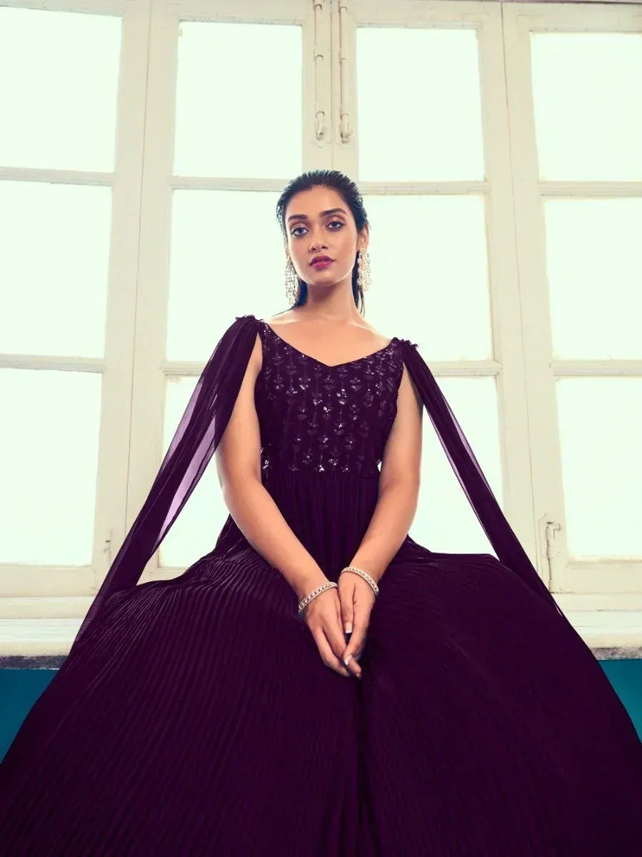 Elegant purple ethnic gown with sequin bodice and pleated skirt, perfect for Indian festive occasions.