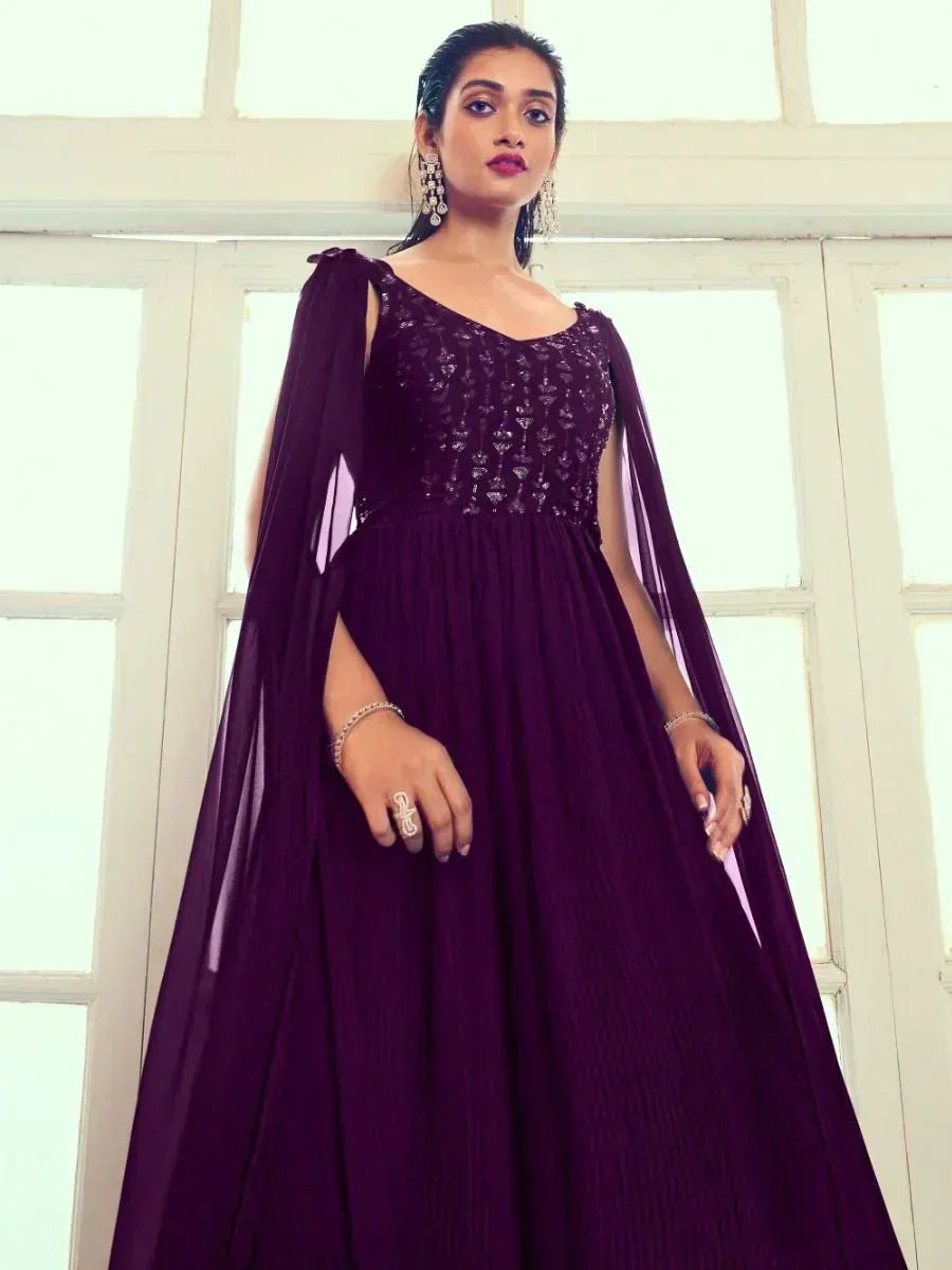 Elegant purple ethnic gown with sequin bodice and cape sleeves, perfect for Indian weddings and parties