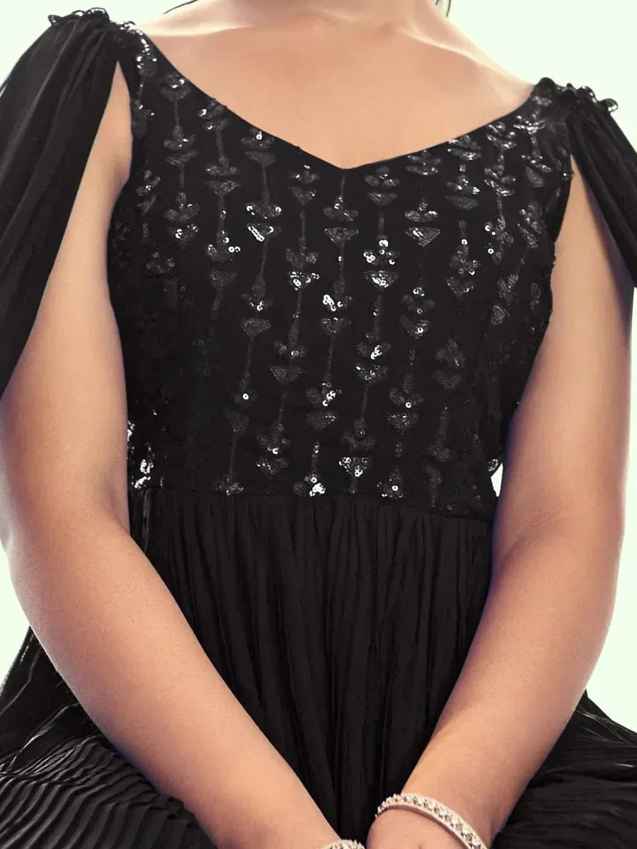 Black sequin ethnic gown with off-shoulder sleeves, perfect for Indian occasions and parties.