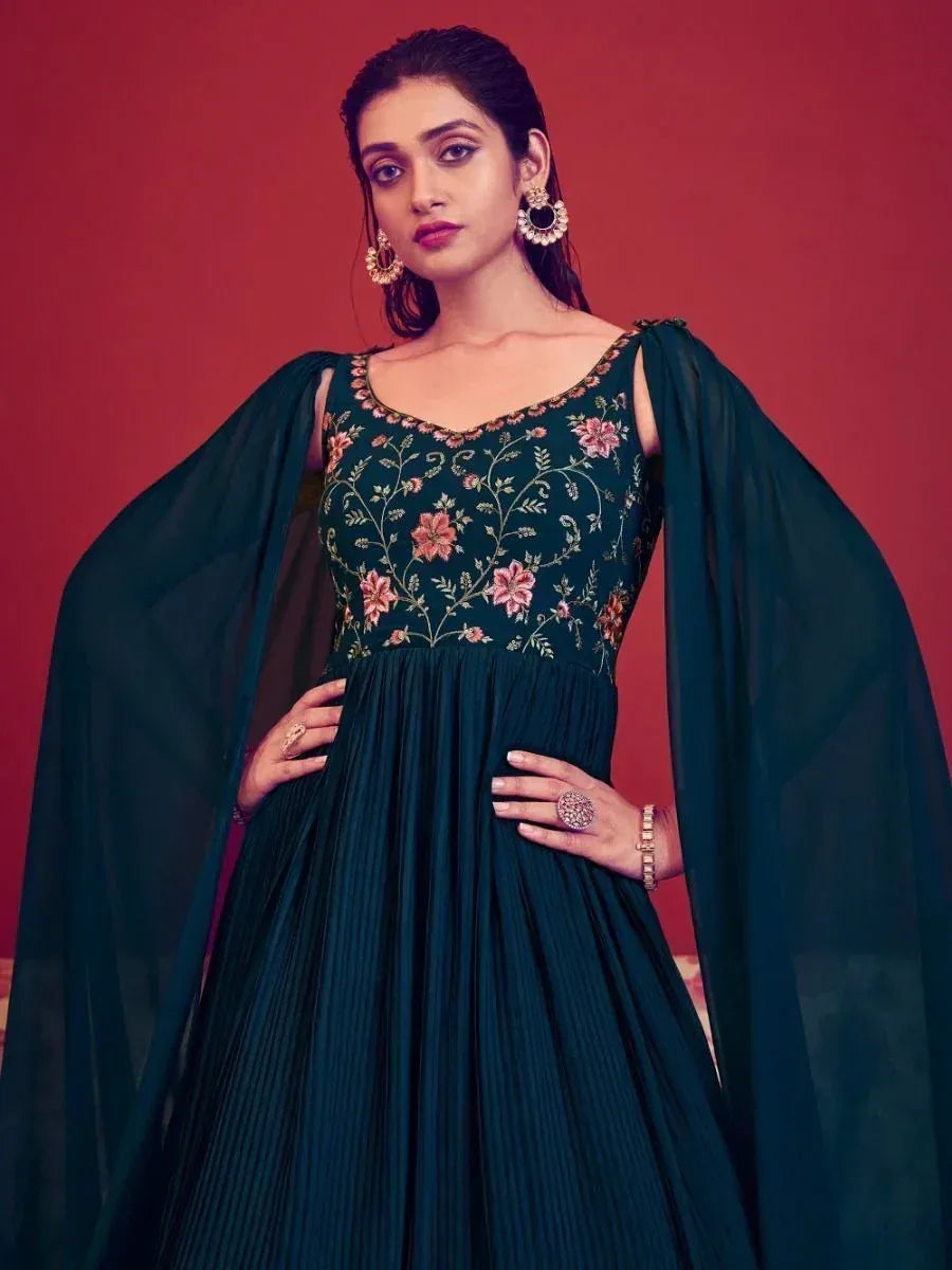 Emerald green embroidered ethnic gown with floral detailing and cape sleeves for women