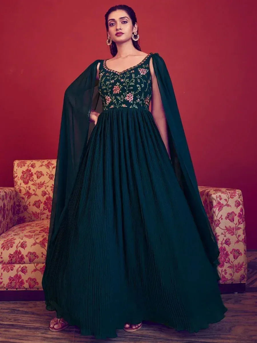 Emerald green embroidered ethnic gown with cape sleeves, perfect for Indian festive occasions