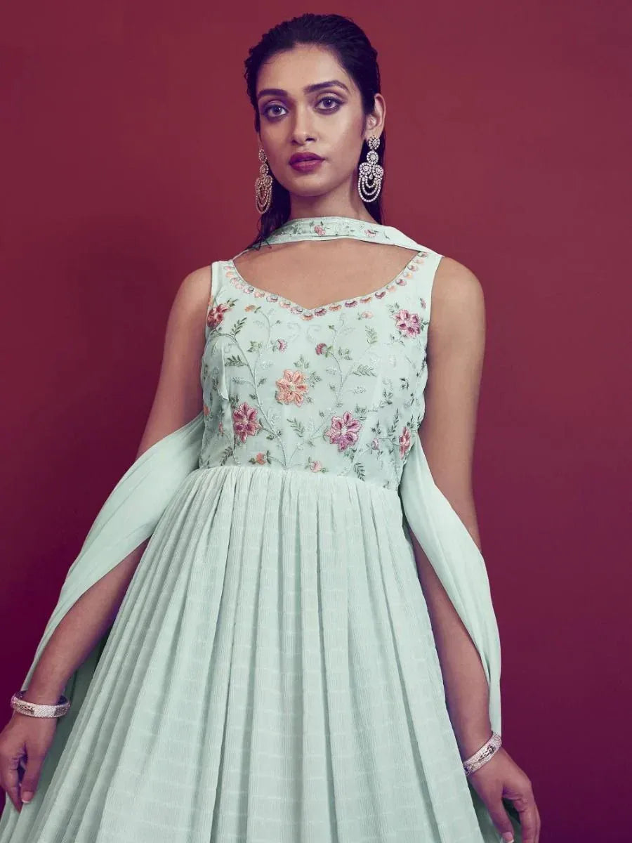 Mint green floral embroidered ethnic gown with cape sleeves, perfect for Indian occasions