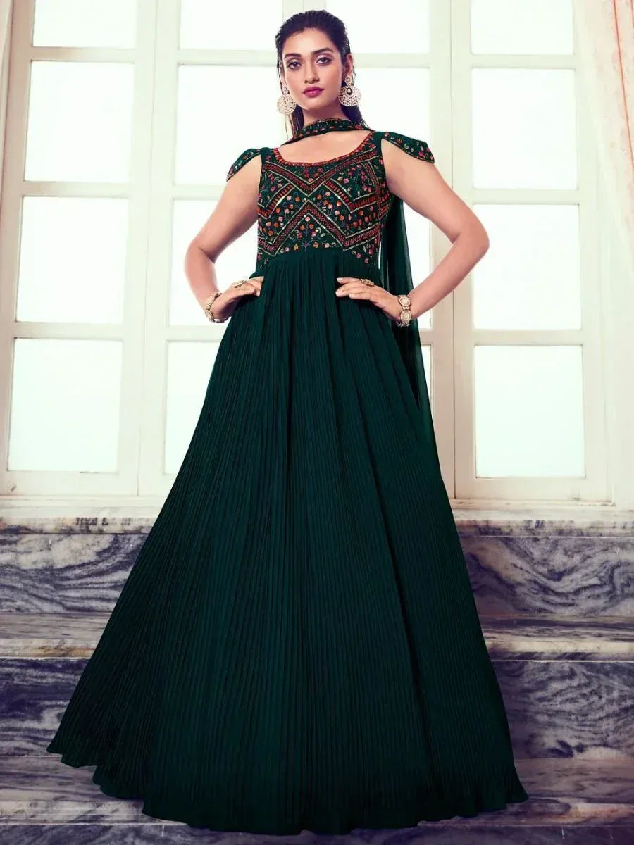 Emerald green ethnic gown with embroidered bodice and pleated skirt, perfect for Indian occasions