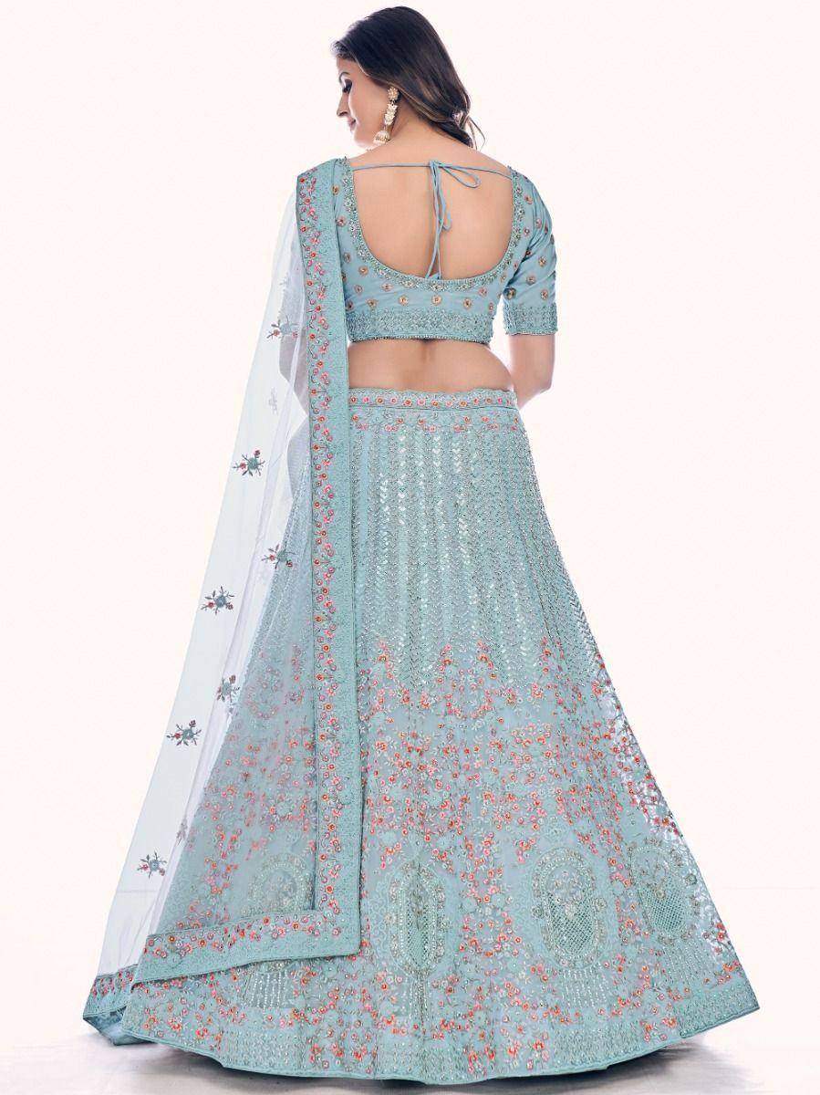 Light blue embroidered lehenga choli with open back blouse and floral dupatta, perfect for Indian weddings