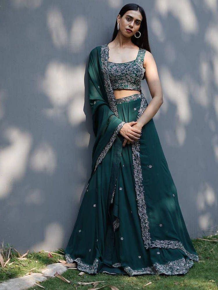 Emerald green lehenga choli with silver embroidery, perfect for Indian ethnic wear occasions