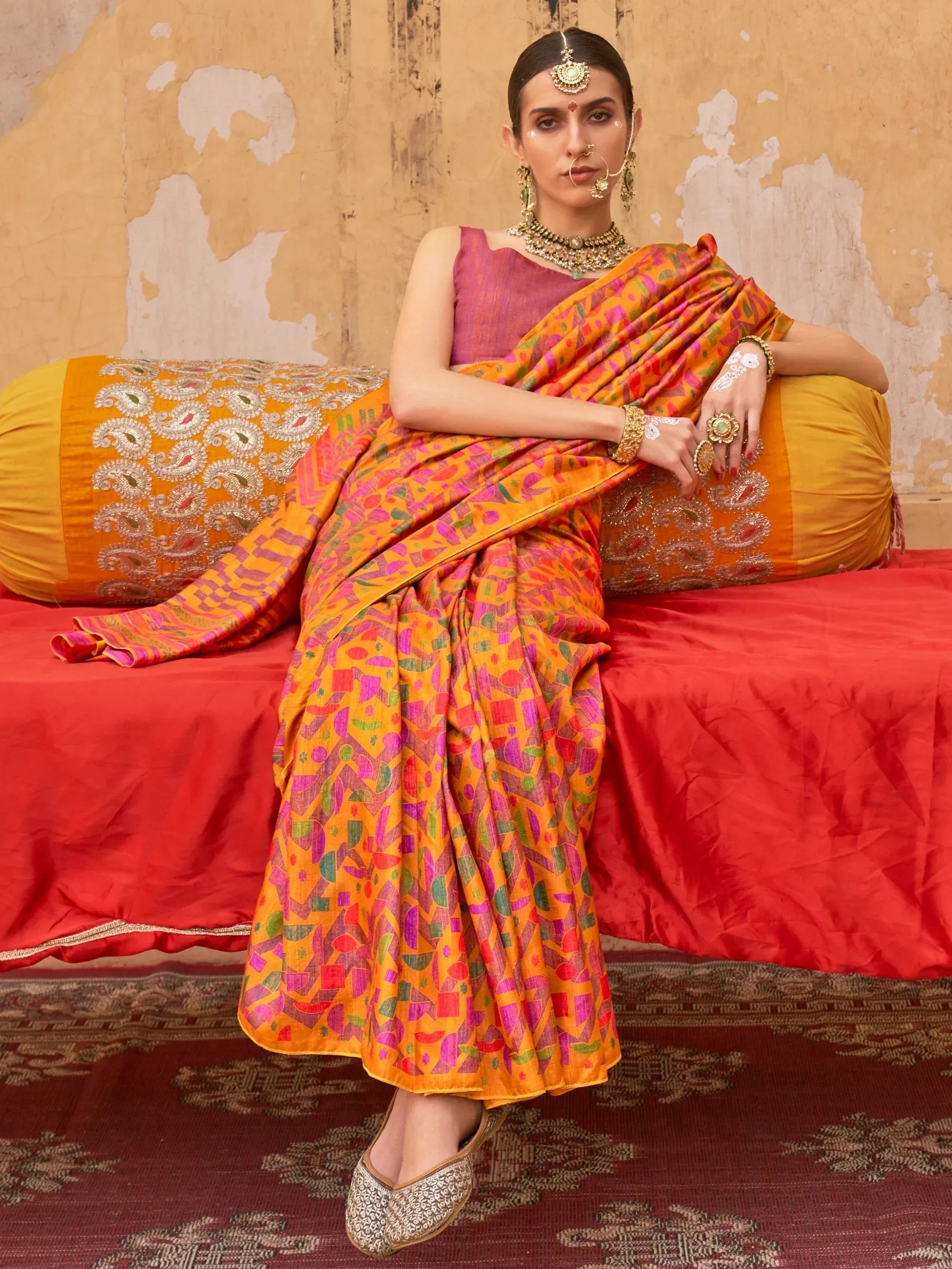 Vibrant orange printed saree with purple blouse, traditional Indian ethnic wear, perfect for festive occasions