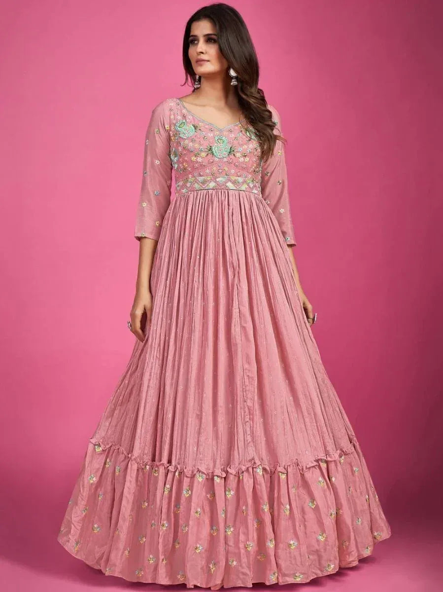 Pink embroidered ethnic gown with floral detailing, perfect for Indian festive occasions