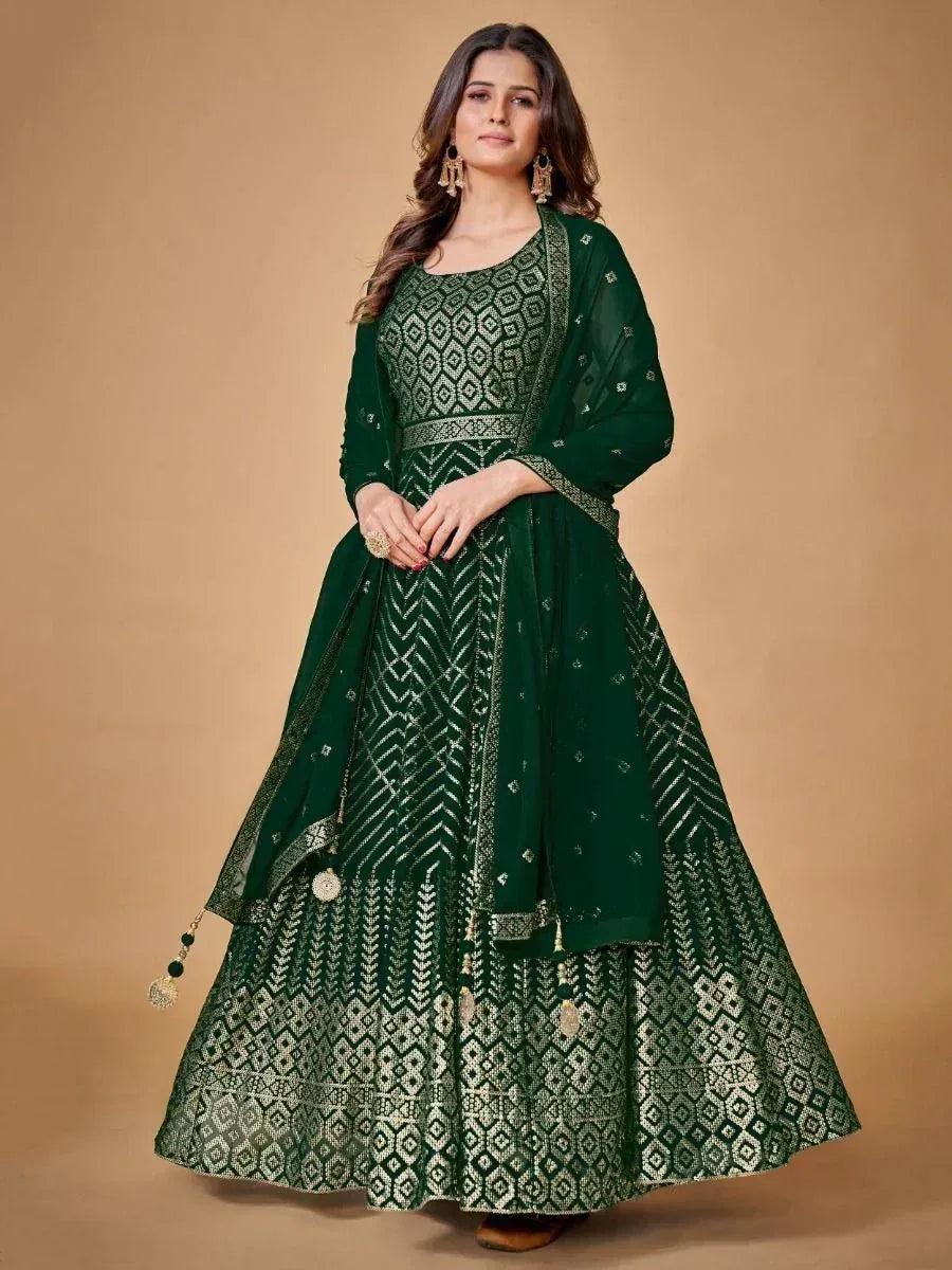 Emerald green designer lehenga choli with geometric embroidery and dupatta, perfect for Indian ethnic occasions.