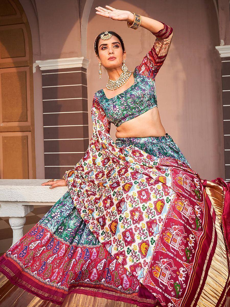 Woman in colorful printed lehenga choli with floral and geometric patterns, traditional Indian ethnic wear