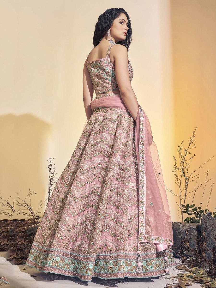 Pink embroidered lehenga choli with floral patterns, perfect for Indian ethnic wear occasions