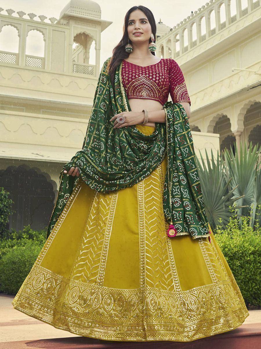 Yellow lehenga with maroon blouse and green dupatta, Indian ethnic wear for weddings and festivals