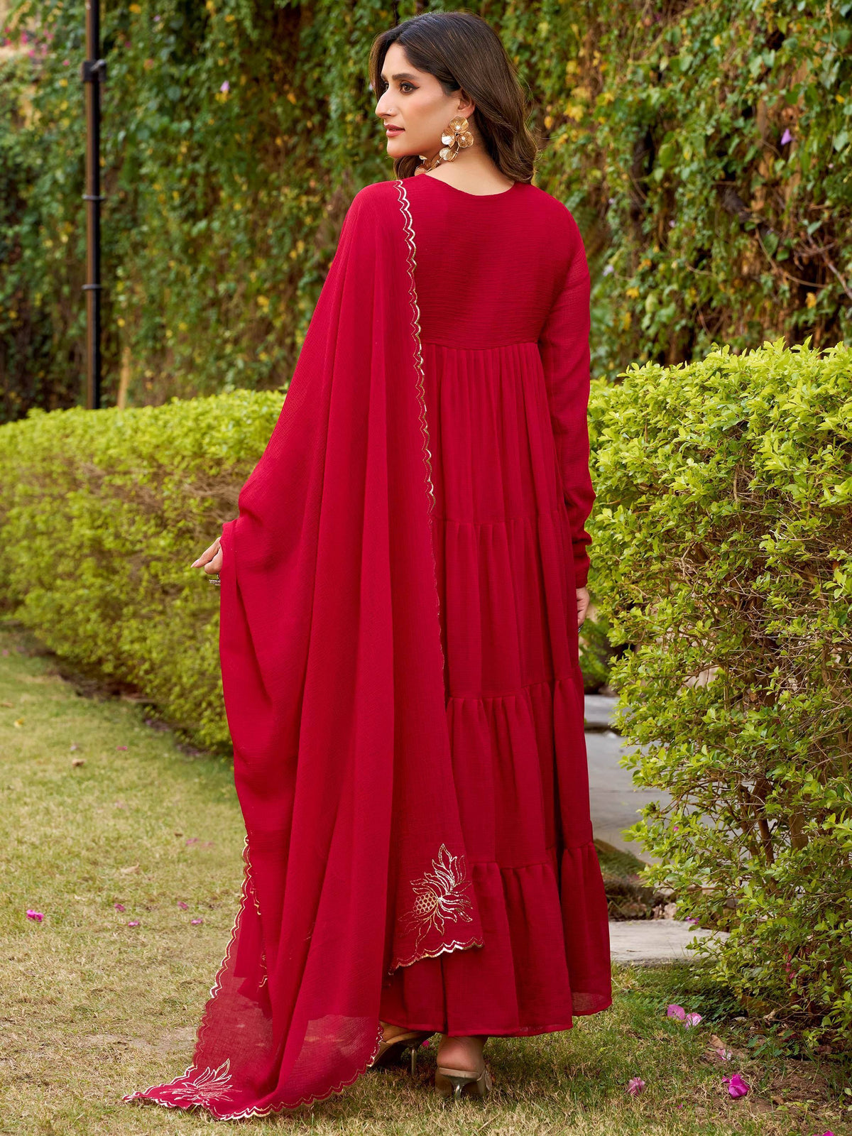 Red tiered ethnic gown with gold embroidery and matching dupatta, perfect for Indian occasions