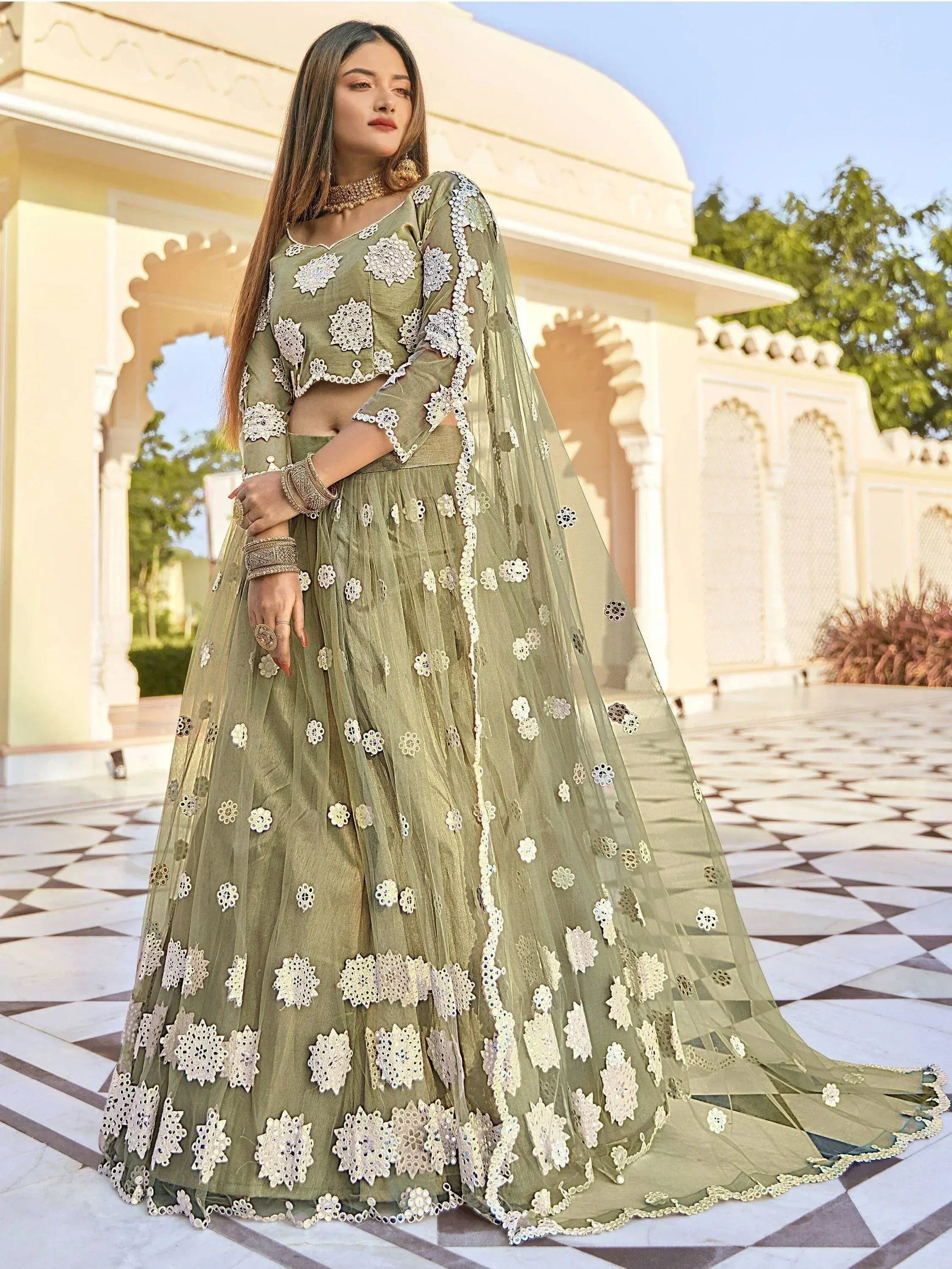 Olive green designer lehenga choli with floral embroidery, perfect for Indian ethnic wear events.