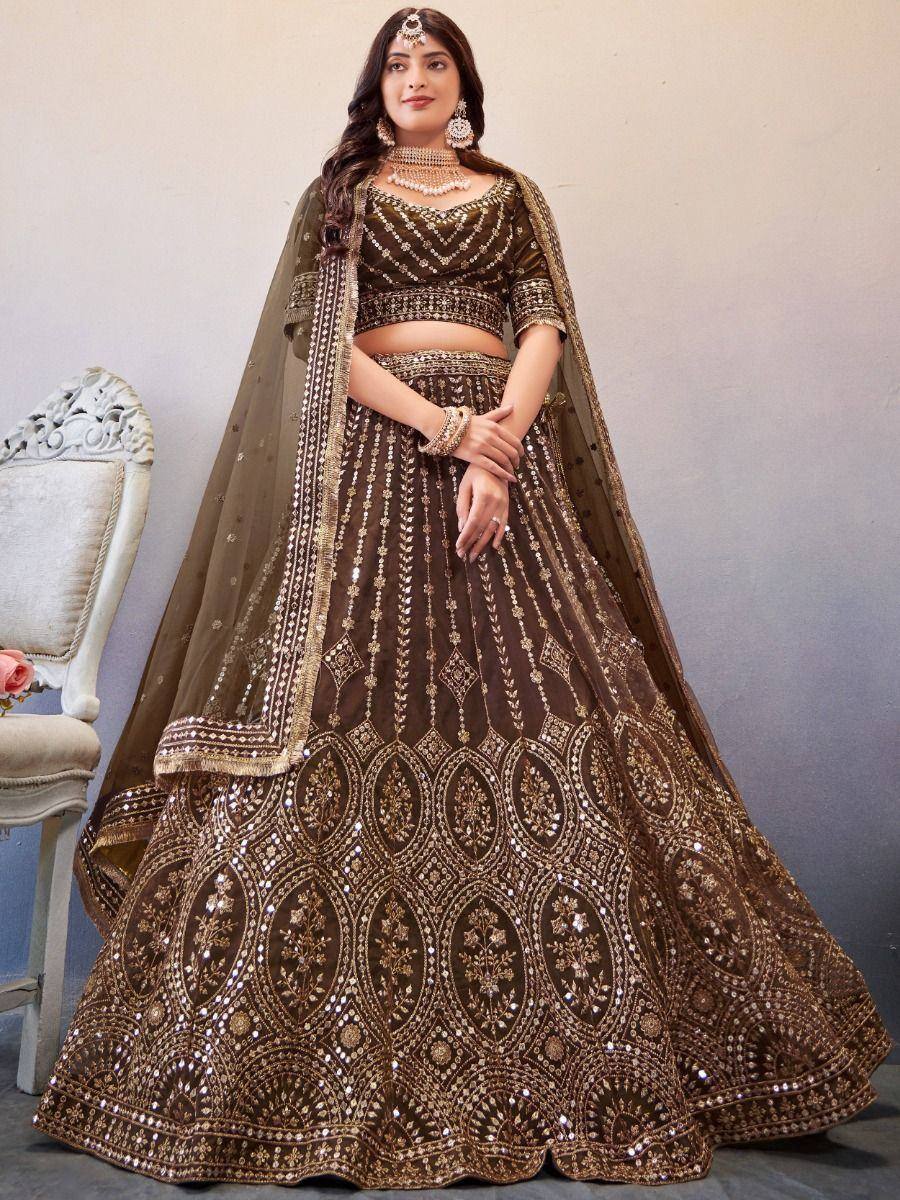 Elegant brown designer lehenga choli with heavy gold embroidery and mirror work, perfect for weddings